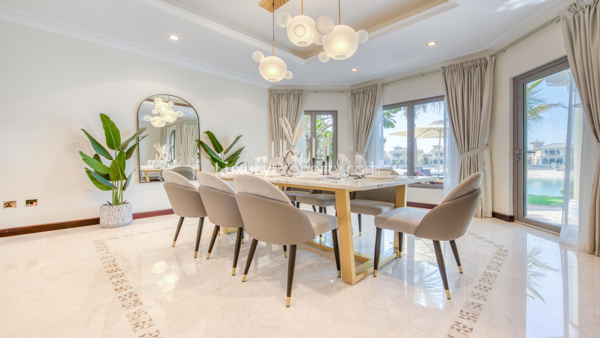 Contemporary kitchen in Palm Jumeirah villa with modern appliances and dining area, LP12235
