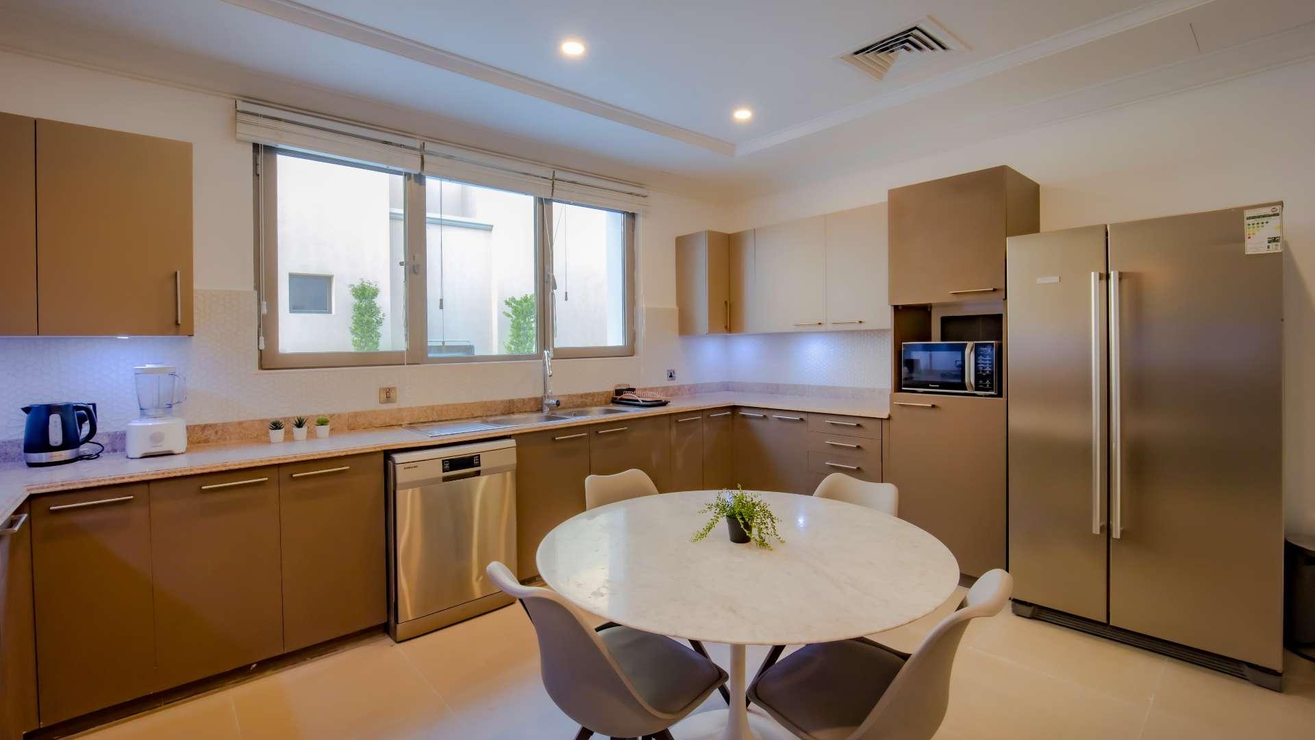 Luxurious living room in upgraded Palm Jumeirah villa with elegant decor and modern furnishings