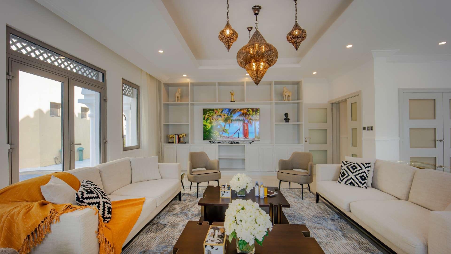 Luxurious living room in upgraded Garden Homes villa, Palm Jumeirah, featuring elegant decor