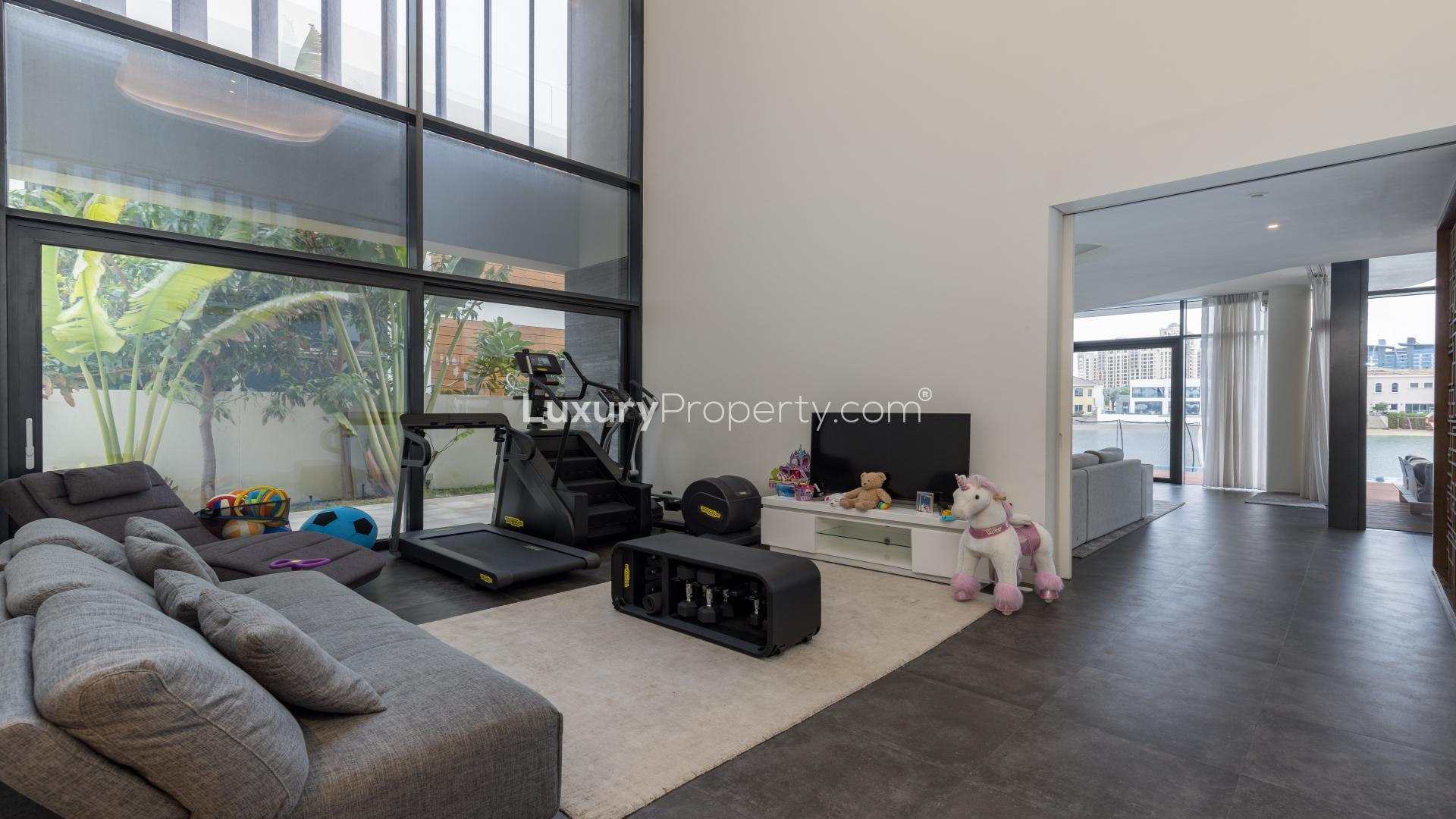 Modern five-bedroom villa exterior in Palm Jumeirah, featuring sleek design and lush landscaping