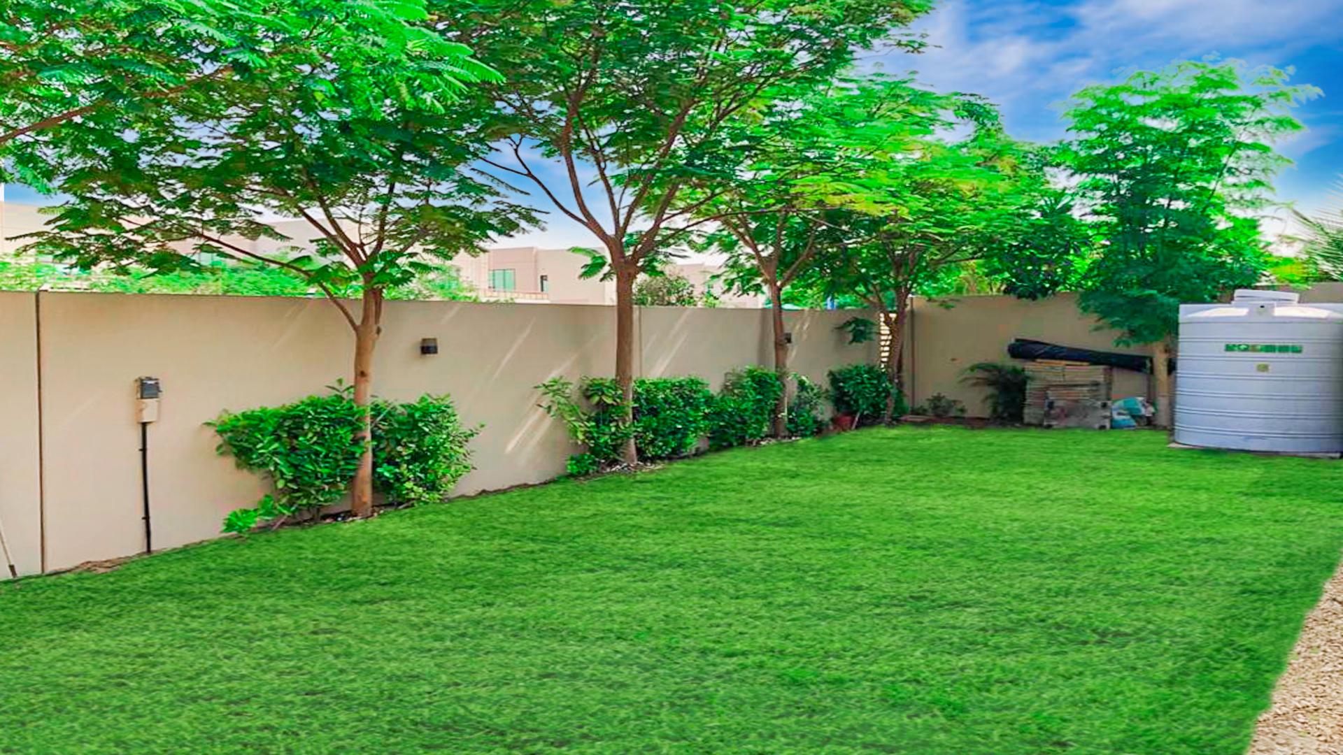 Lush green backyard of luxurious villa in Millennium Estates, Meydan Gated Community