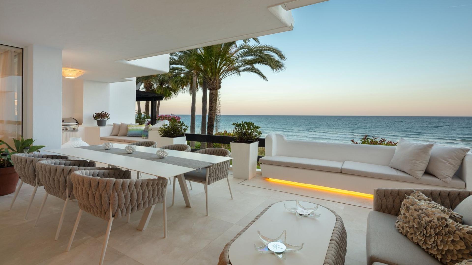Beachfront penthouse terrace with private pool and ocean view in Puente Romano, Marbella