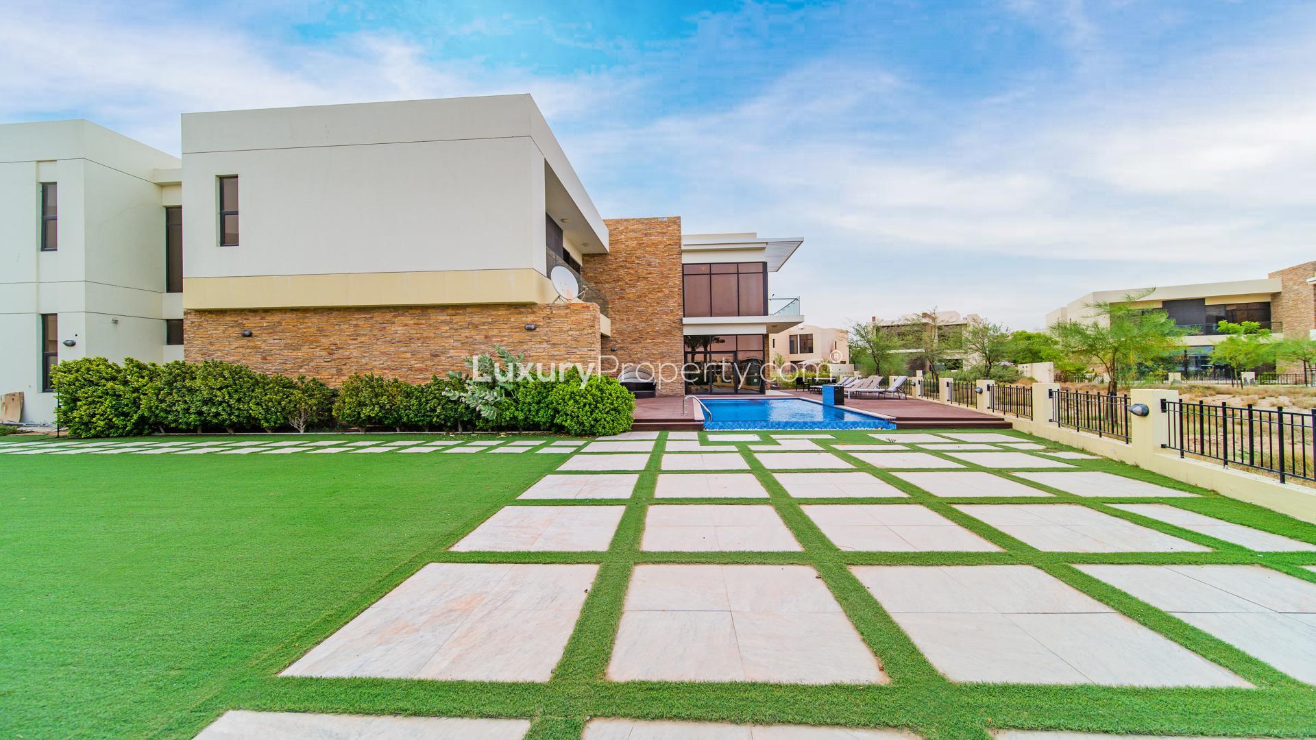 Modern kitchen in Damac Hills villa with sleek countertops and large windows