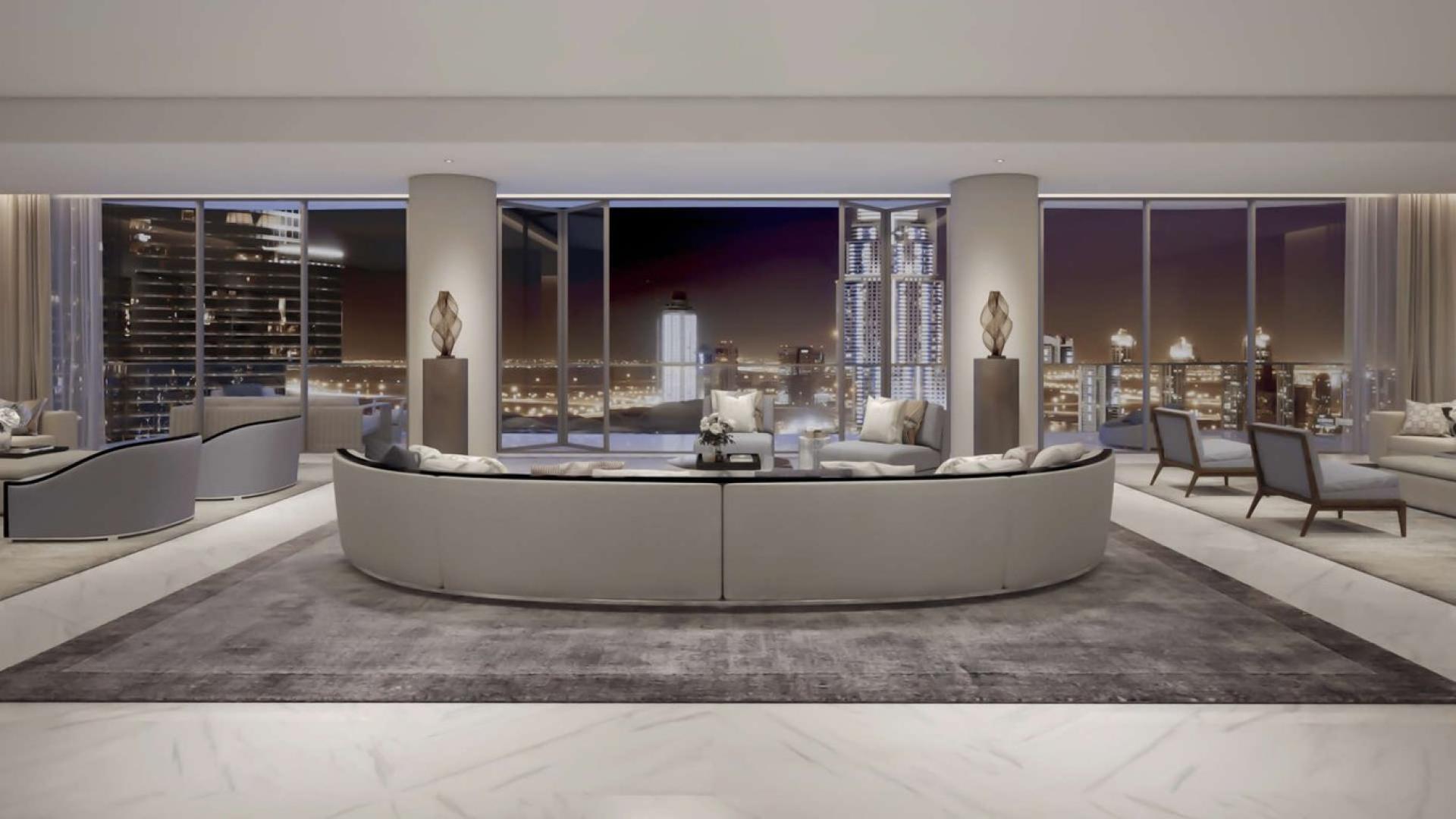 Stunning view from downtown Dubai penthouse overlooking city skyline and fountains at dusk