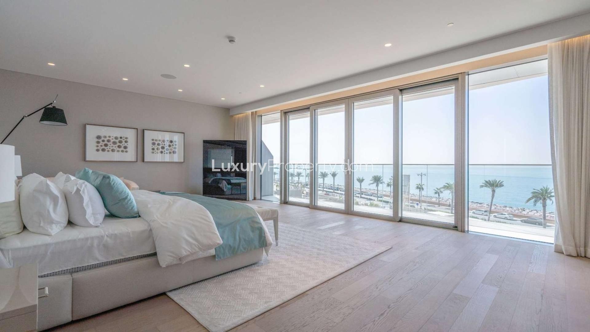 Luxurious Palm Jumeirah penthouse living room with stunning sea views, modern decor, and natural light