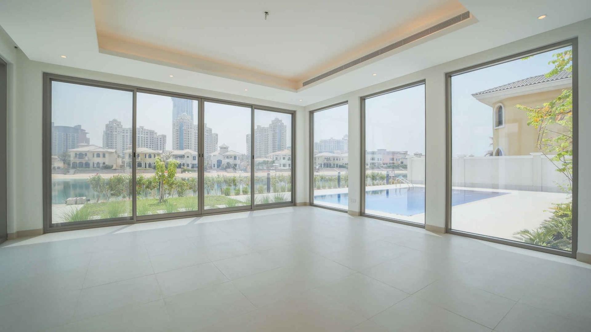 Spacious interior of upgraded 6-bedroom villa in Palm Jumeirah with marina skyline views