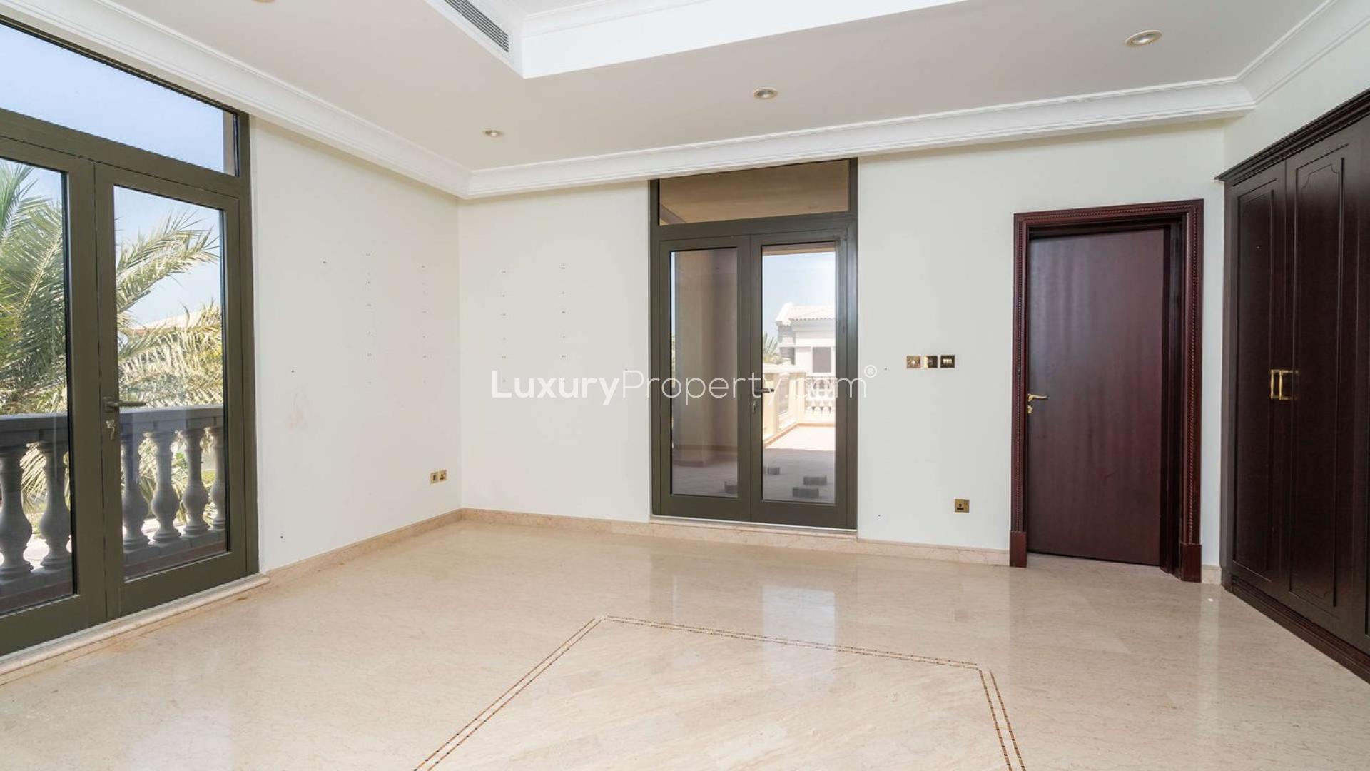 6-bedroom villa exterior on Palm Jumeirah with palm trees and elegant architecture