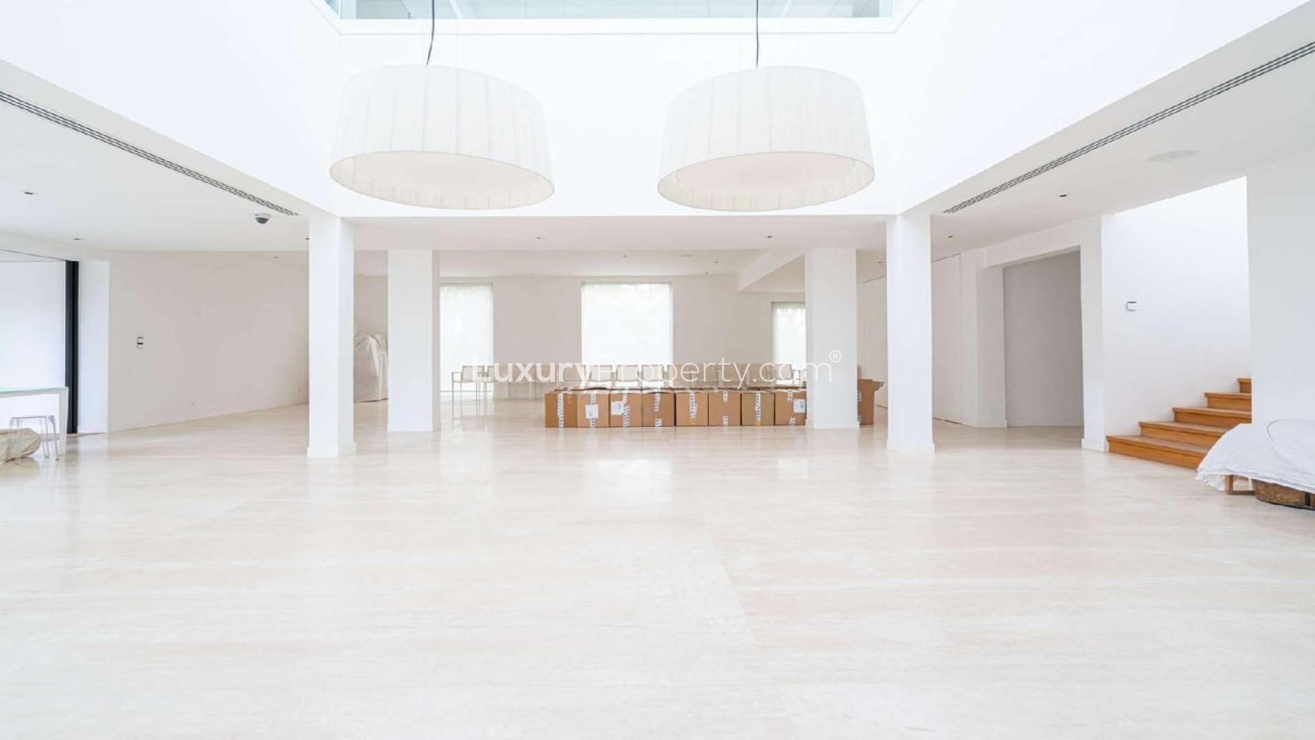 Luxurious Emirates Hills villa with pool, spacious garden, and modern architecture for rent