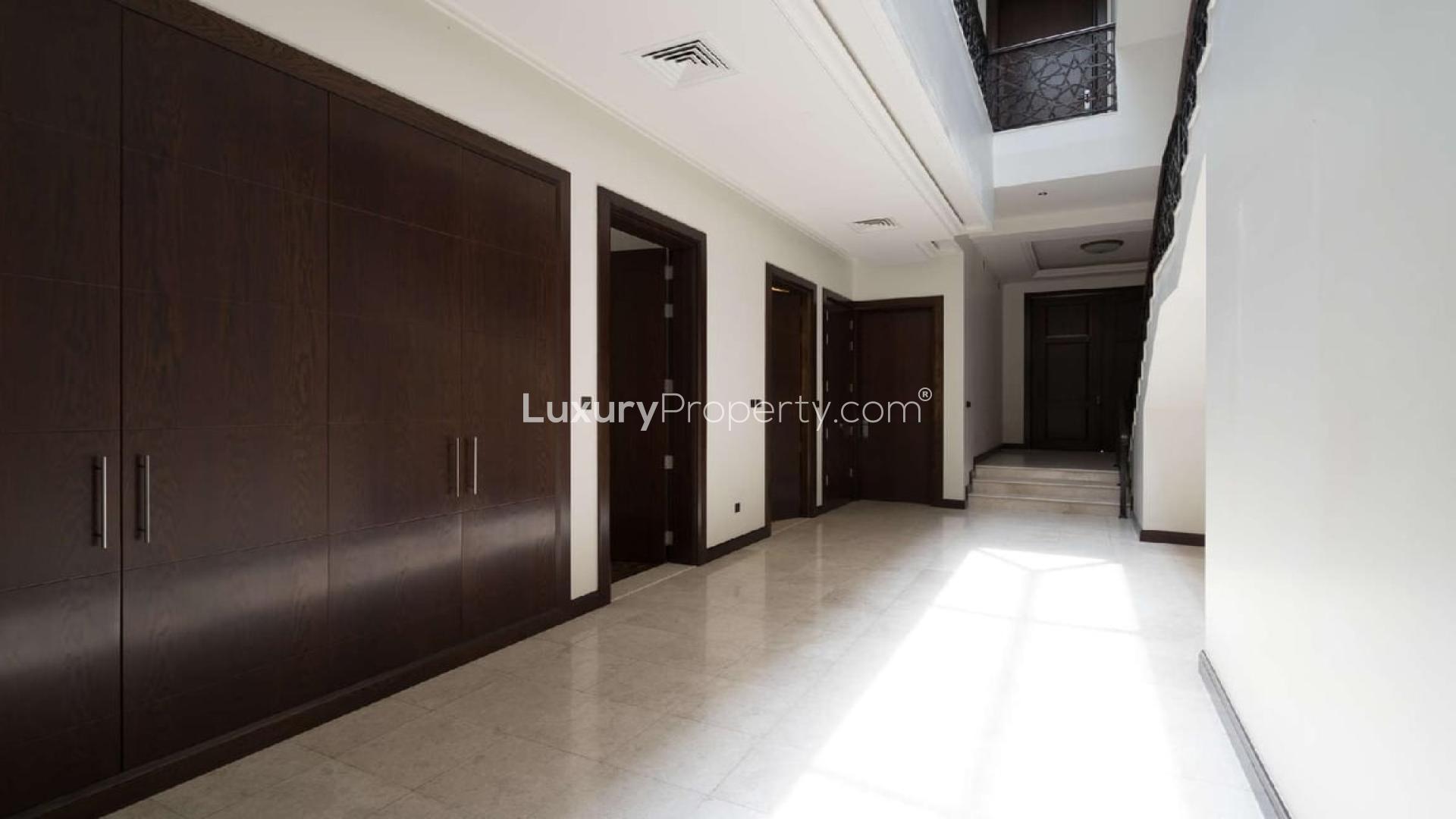 Al Barari 6-bedroom villa for sale, featuring modern design and spacious driveway