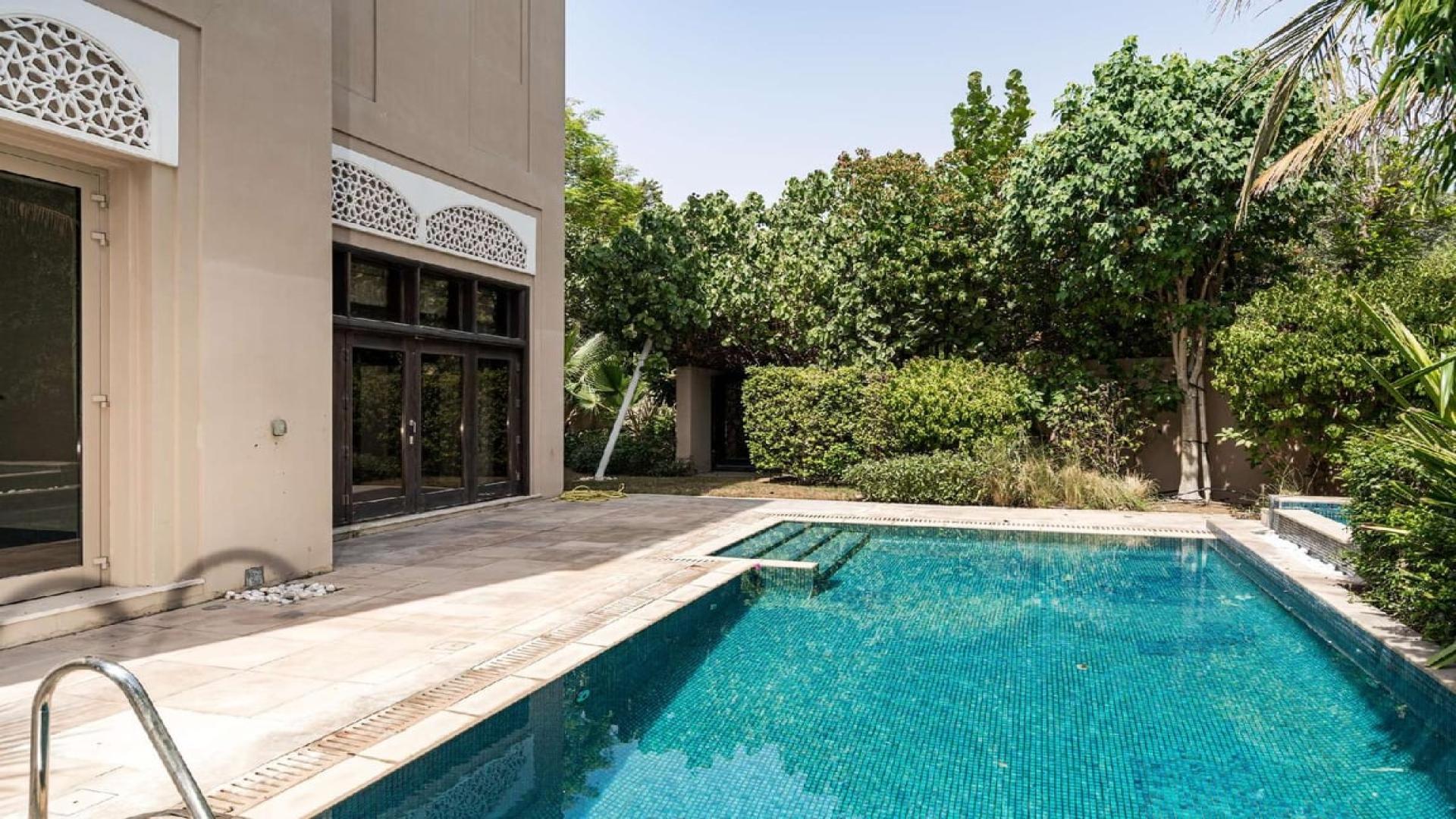 Mediterranean-style villa exterior with garage in Dahlia, Al Barari, for rent