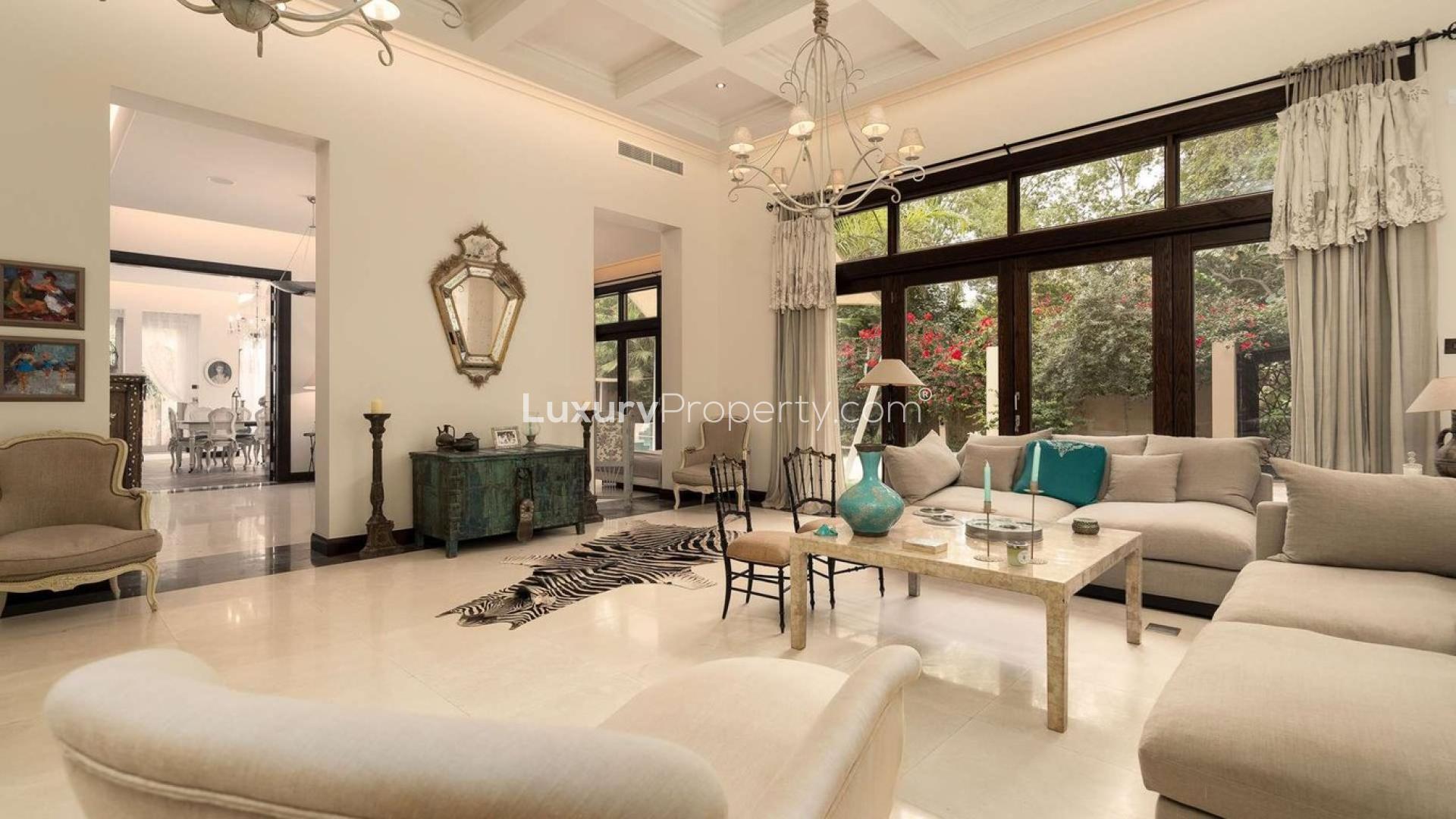Luxurious living room in 6-bed Bromellia Villa, Al Barari, elegant decor and spacious design