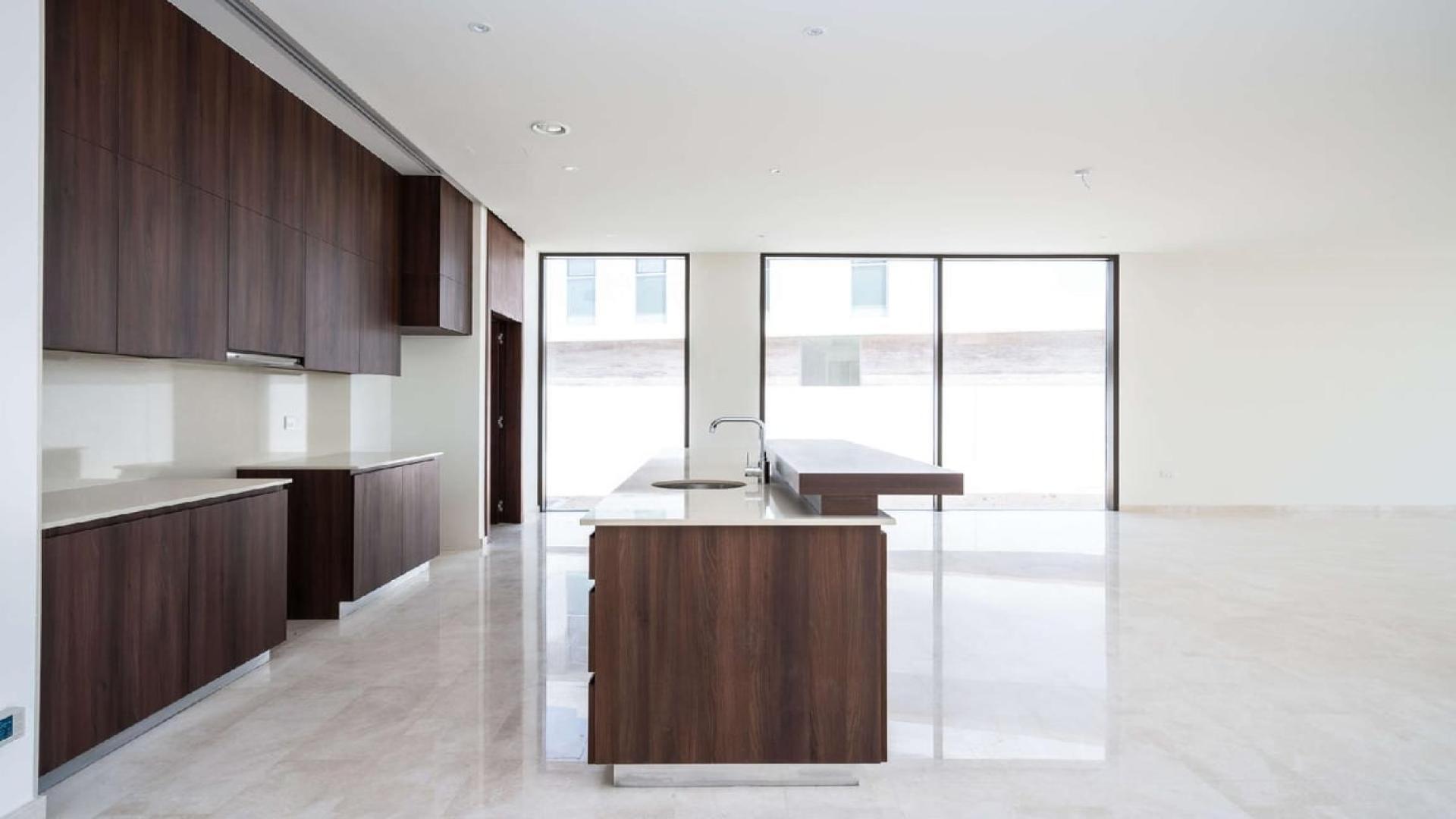 Spacious living area with large windows in Dubai Hills Estate villa for rent