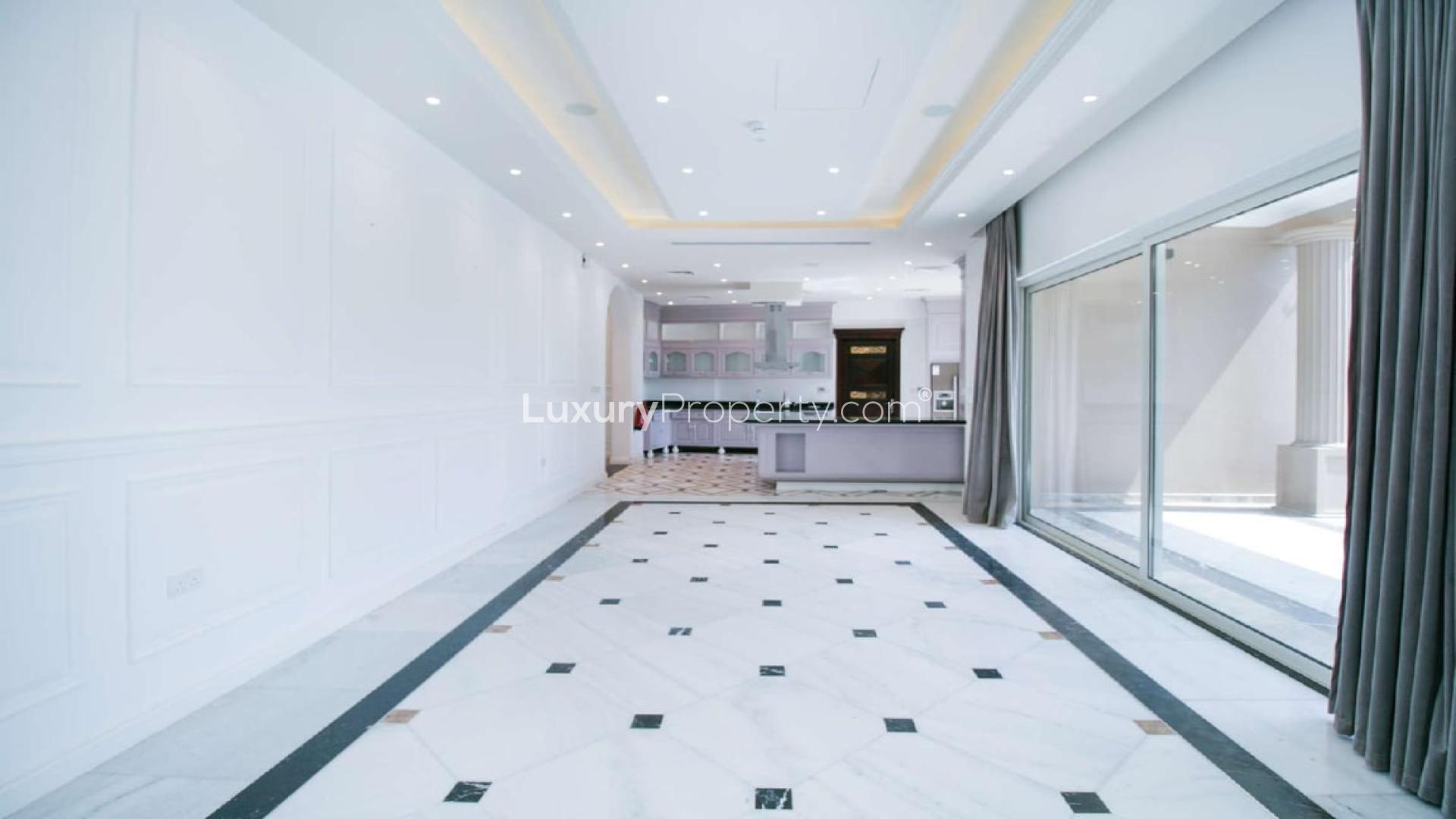 Exclusive 6-bedroom villa exterior in Wildflower, Jumeirah Golf Estates, lush landscaping, spacious driveway