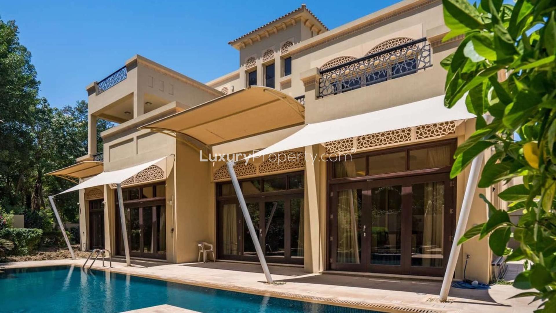 Exterior view of luxury villa with pool in Al Barari, Dubai, available for rent