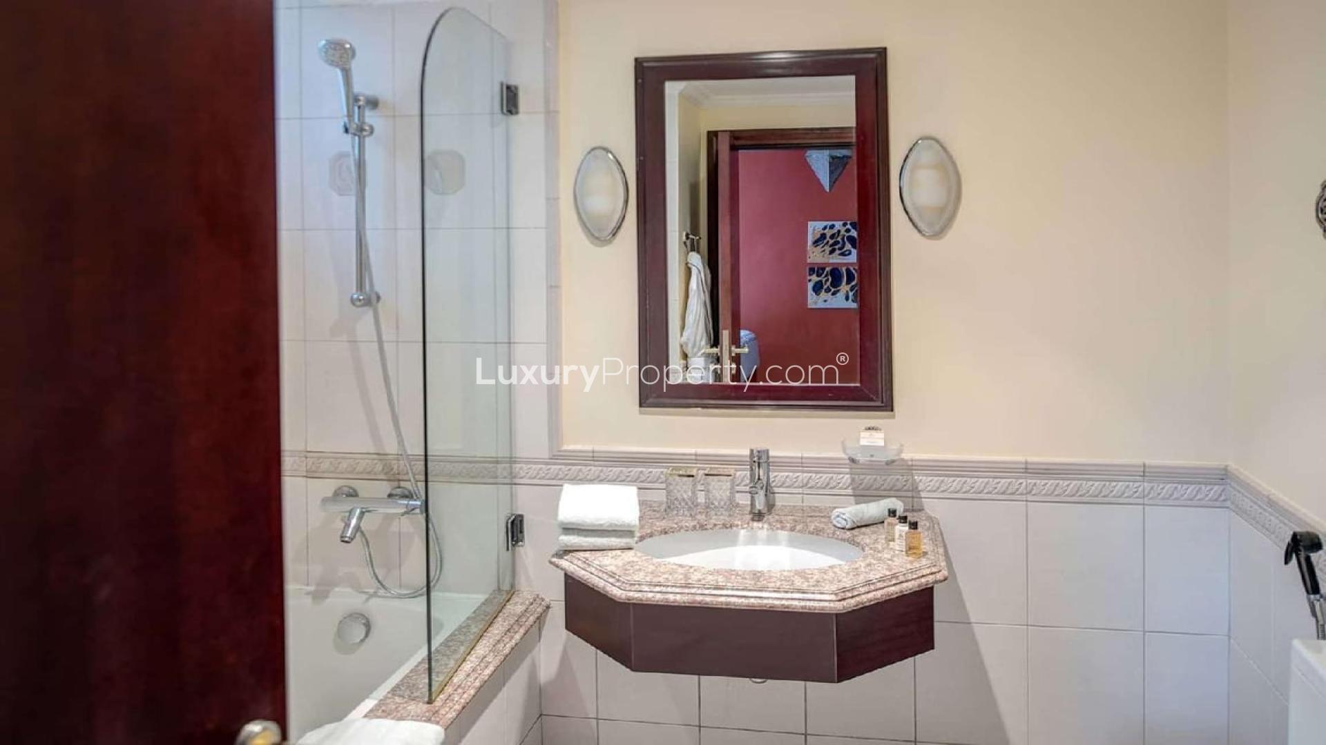 Luxurious 6-bedroom villa exterior in Palm Jumeirah's Garden Homes, available for rent