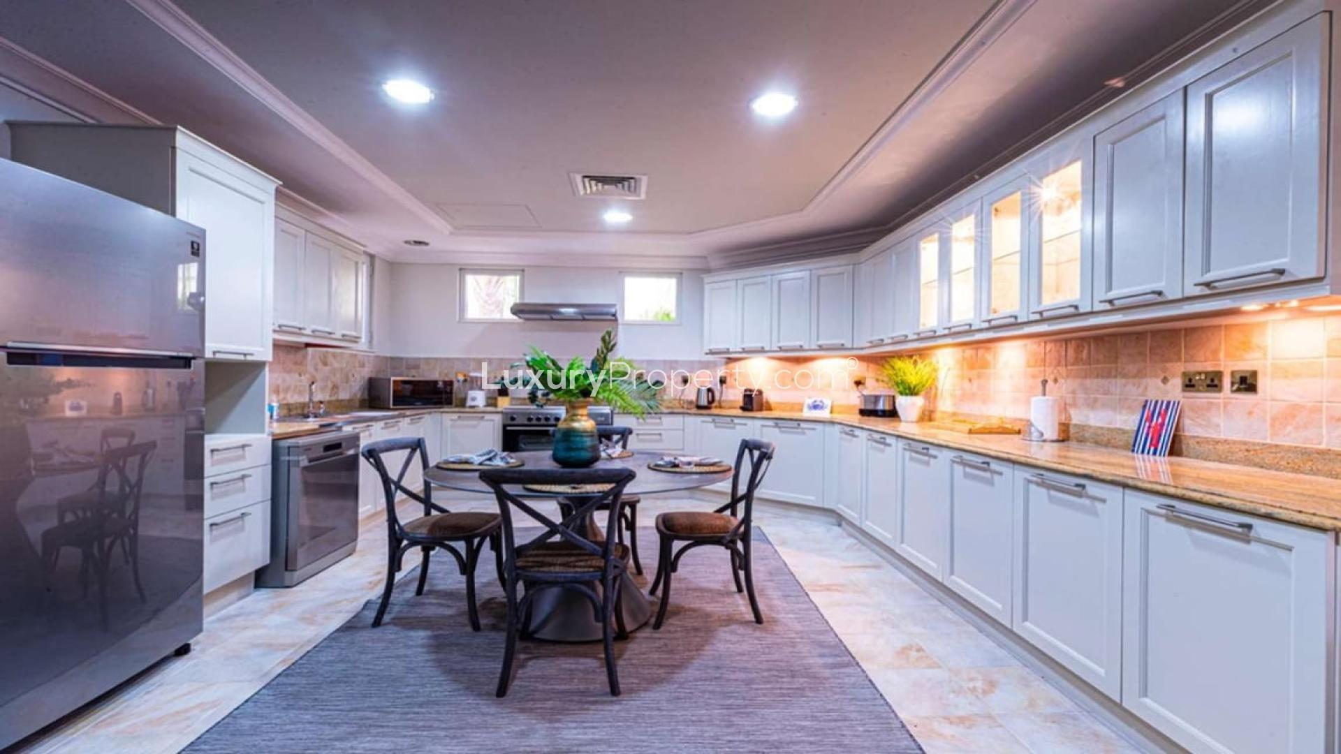 Beautiful Malibu-style villa in Palm Jumeirah's Garden Homes with lush landscaping