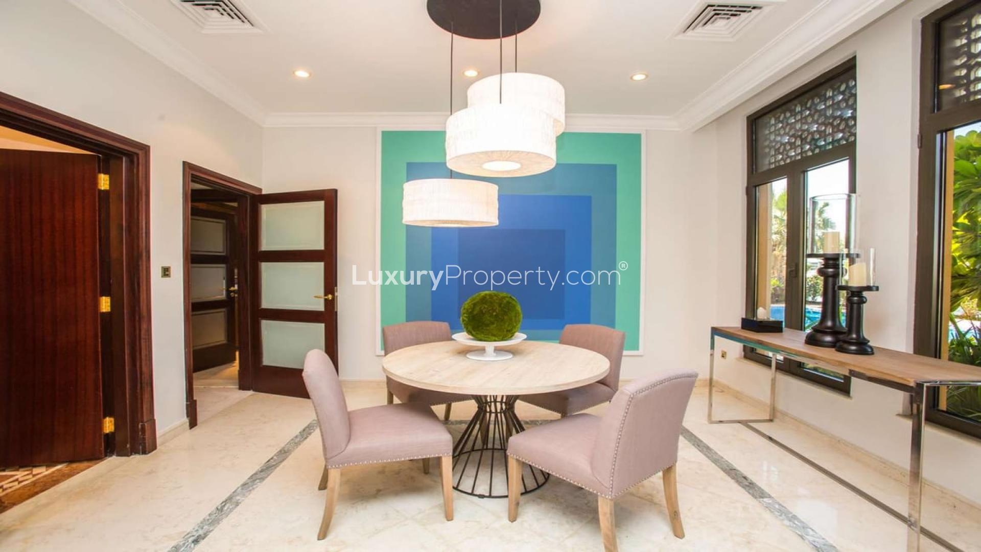 Dining area in luxury villa, Palm Jumeirah, with modern decor and elegant furnishings