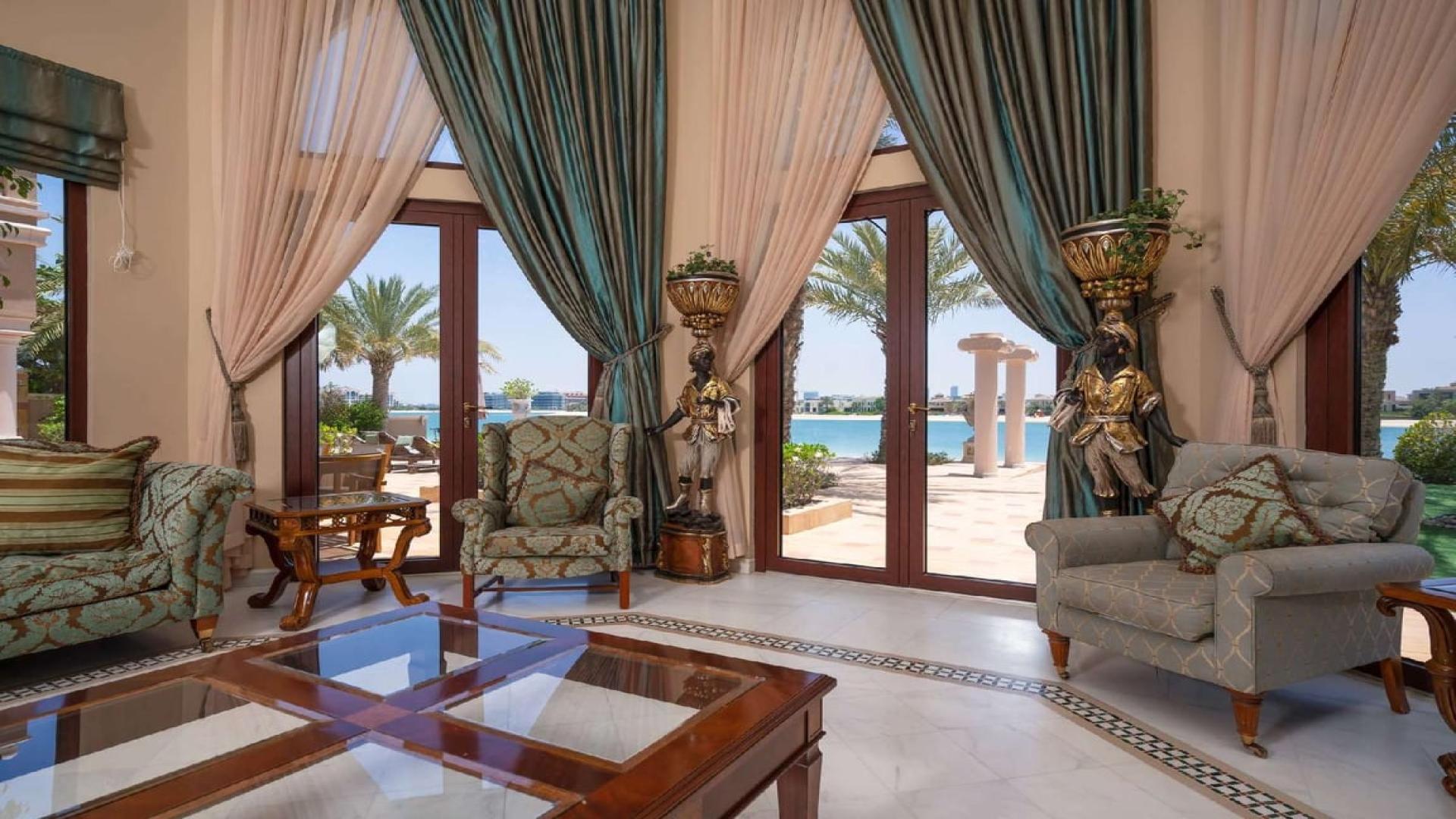 Luxurious living room in upgraded Palm Jumeirah villa with sea view and elegant decor