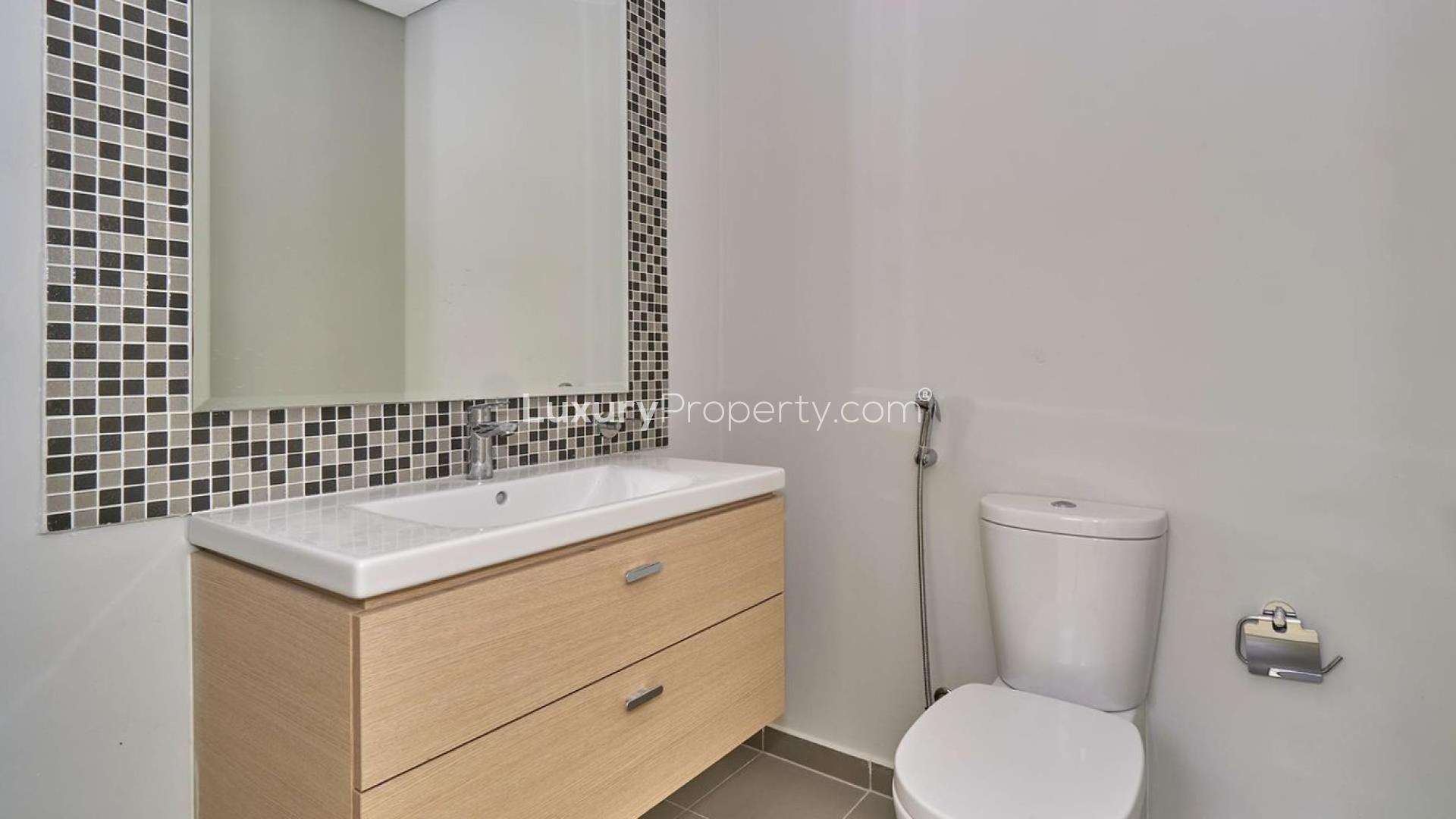 Spacious living area with large windows in Claret Cluster villa, Damac Hills 2, Dubai