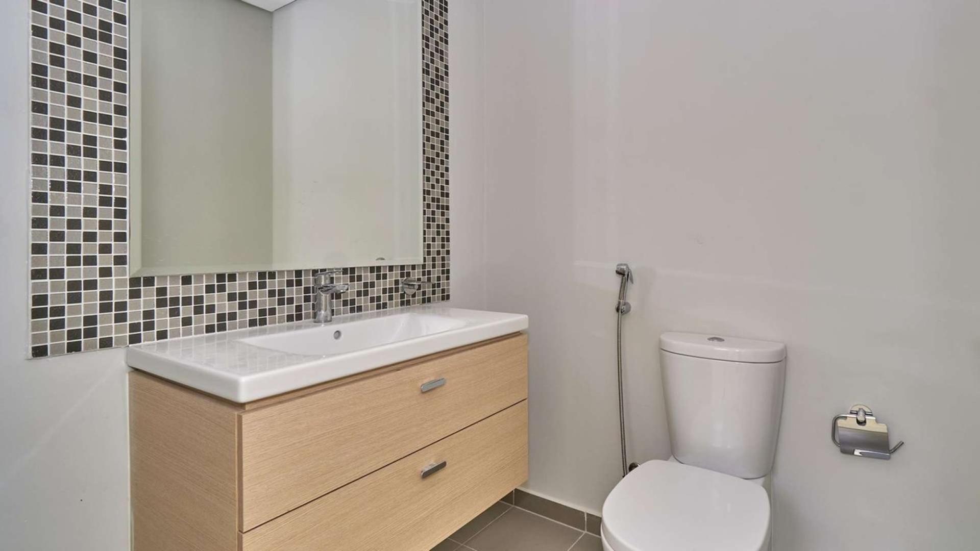 Spacious living area with large windows in Claret Cluster villa, Damac Hills 2, Dubai