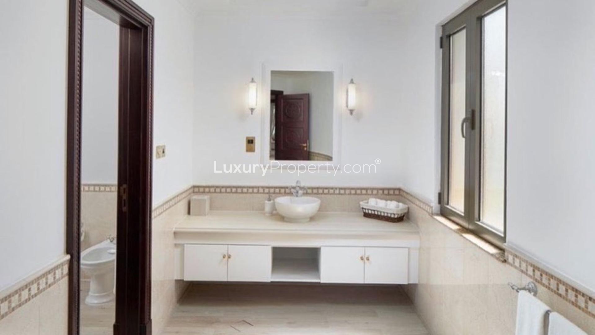 Luxurious bathroom in furnished Signature Villa, Palm Jumeirah, with elegant fixtures and spacious layout