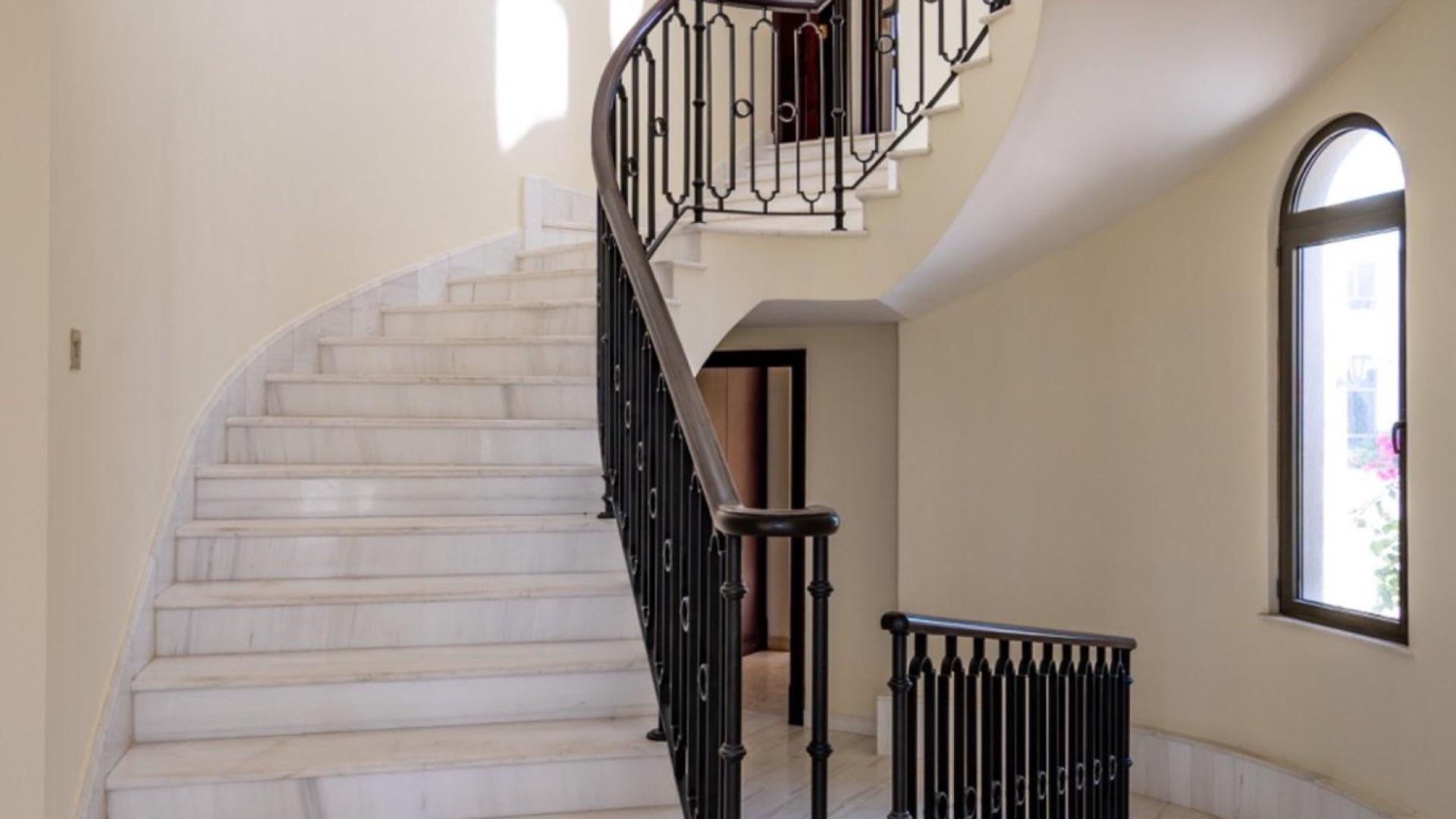 Interior of spacious villa with large windows, marble floors, Palm Jumeirah Signature Villas