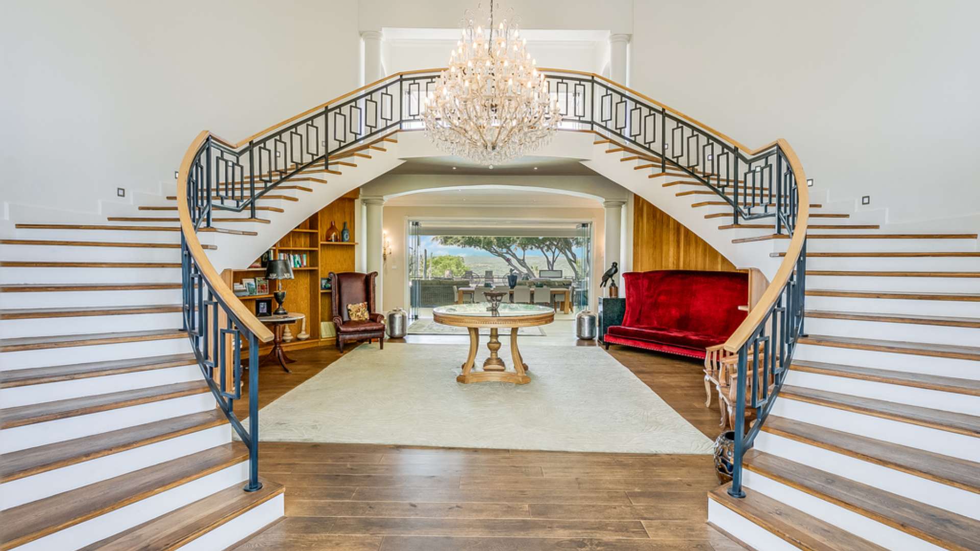 Luxurious living room in 6-bedroom Georgian manor, Bryanston, featuring elegant decor and fireplace