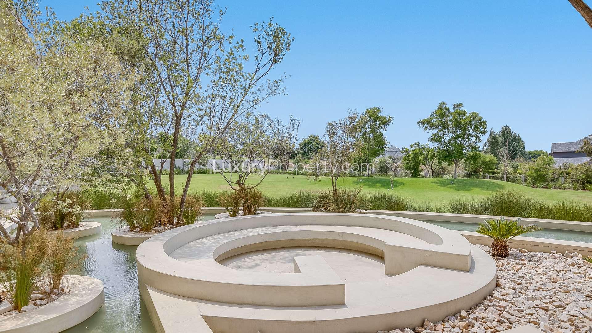 Luxury villa garden with water feature in Dubai Waterfront, Waterfall District