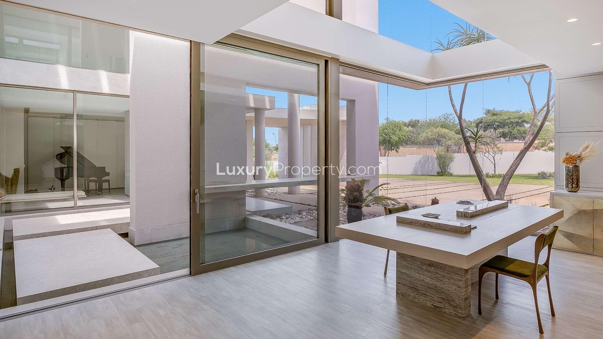 Luxurious villa garden with modern water feature in Waterfall City, Dubai Waterfront