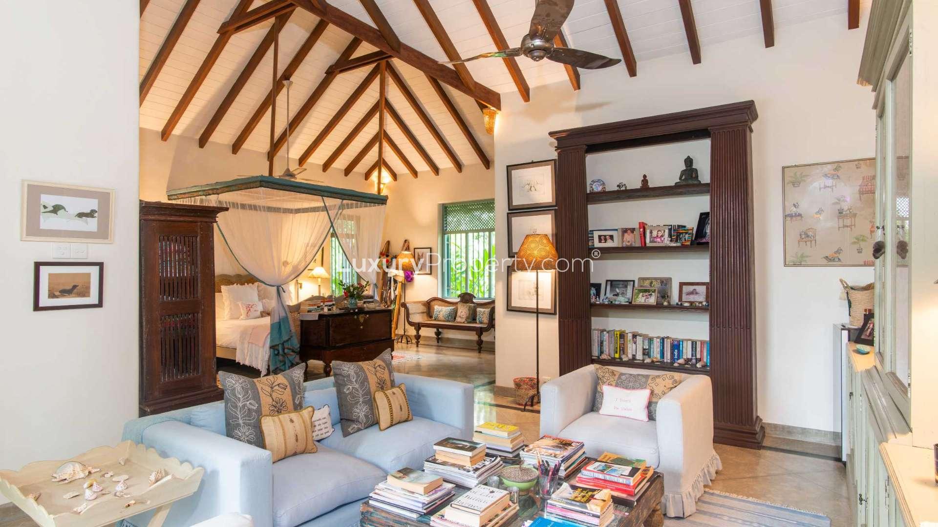 Spacious kitchen in luxurious Pokkuluwa Estate villa, featuring elegant decor and ample seating