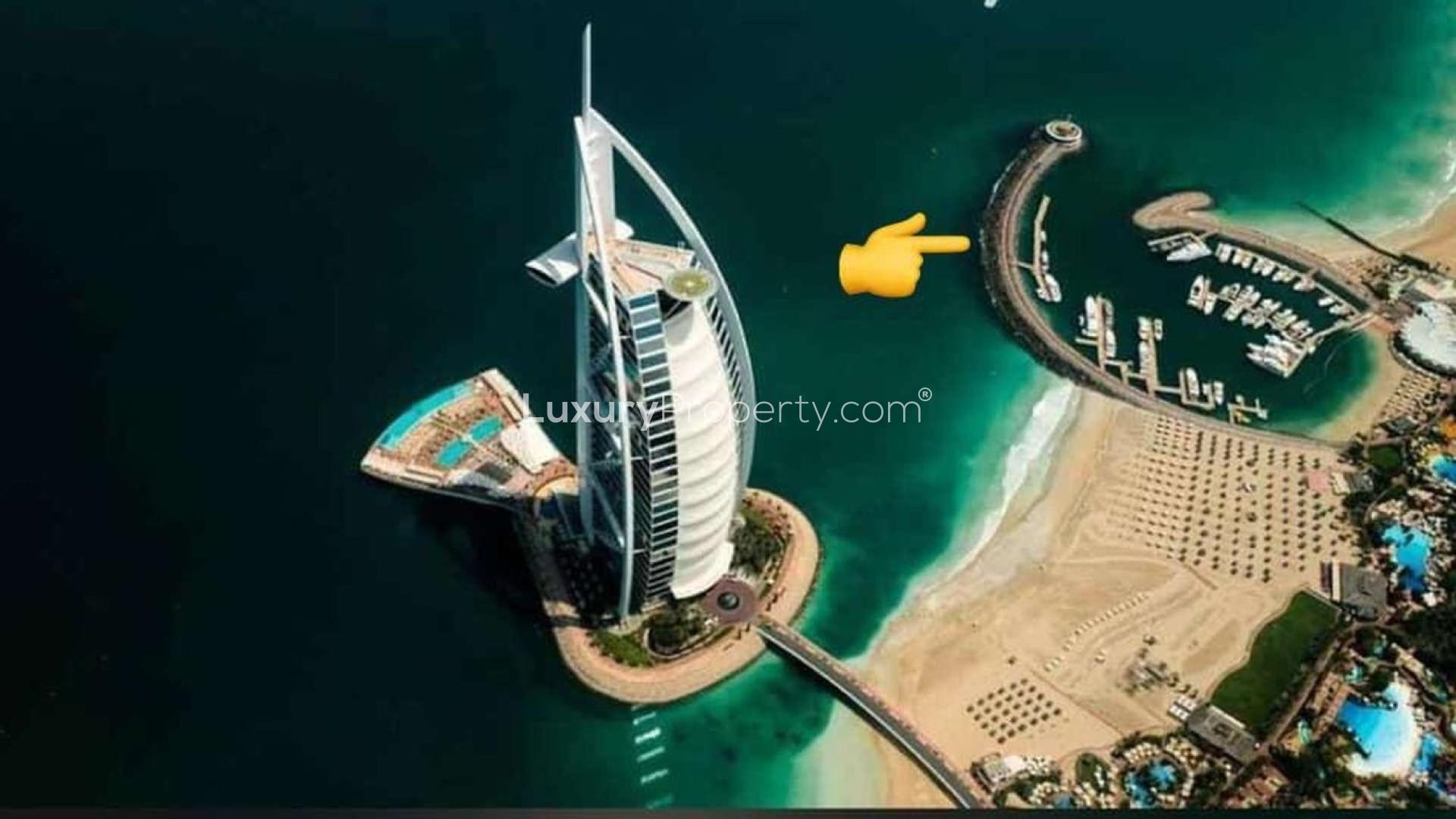 Scale model of Marsa Al Arab Quay Wall Villas, featuring luxury yachts and waterfront views