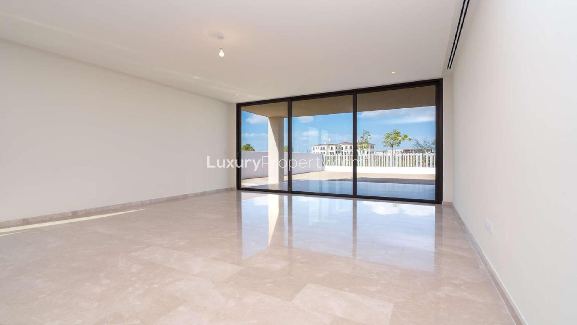 Open-plan living area in villa, Fairway Vistas, Dubai Hills Estate, large windows, spacious layout