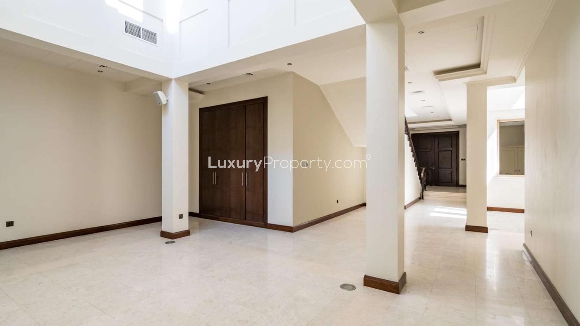 Six-bedroom villa exterior with garage in Ajman Uptown, Al Barari. For sale