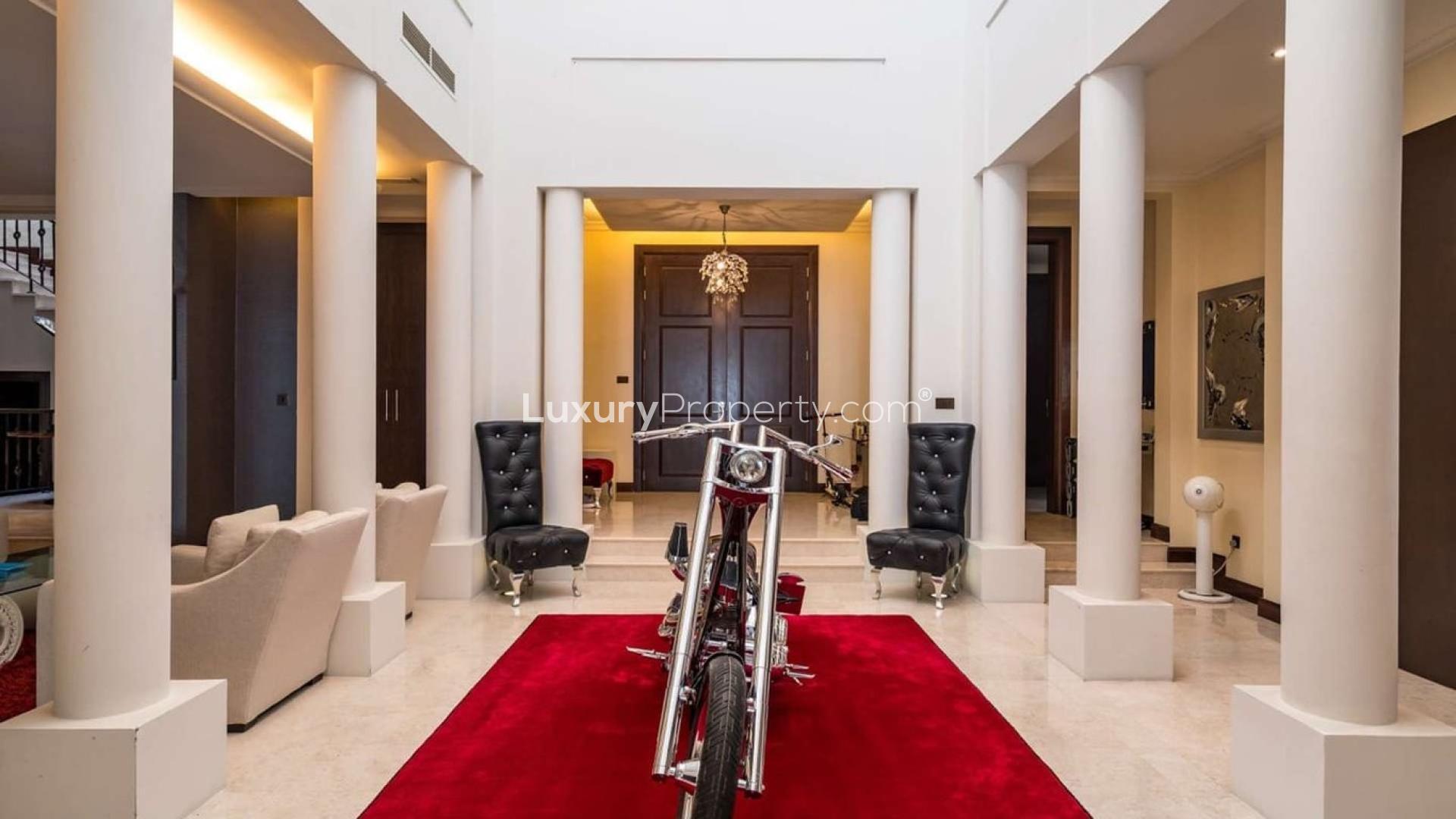 Luxurious villa interior with red carpet and stylish decor in Al Barari, Dubai