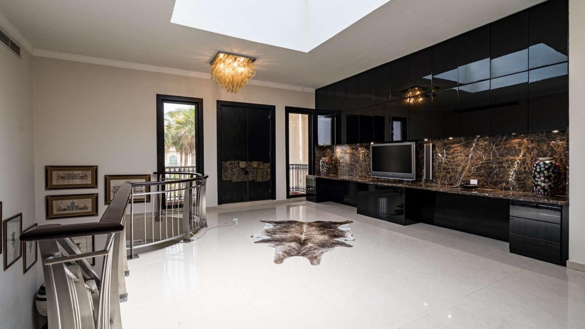 Luxurious living room in Al Manara villa, featuring elegant decor and modern furnishings