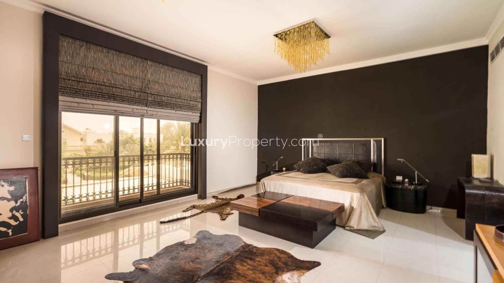 Unique 6-bedroom villa exterior with lush garden in Al Manara, Al Wasl for sale