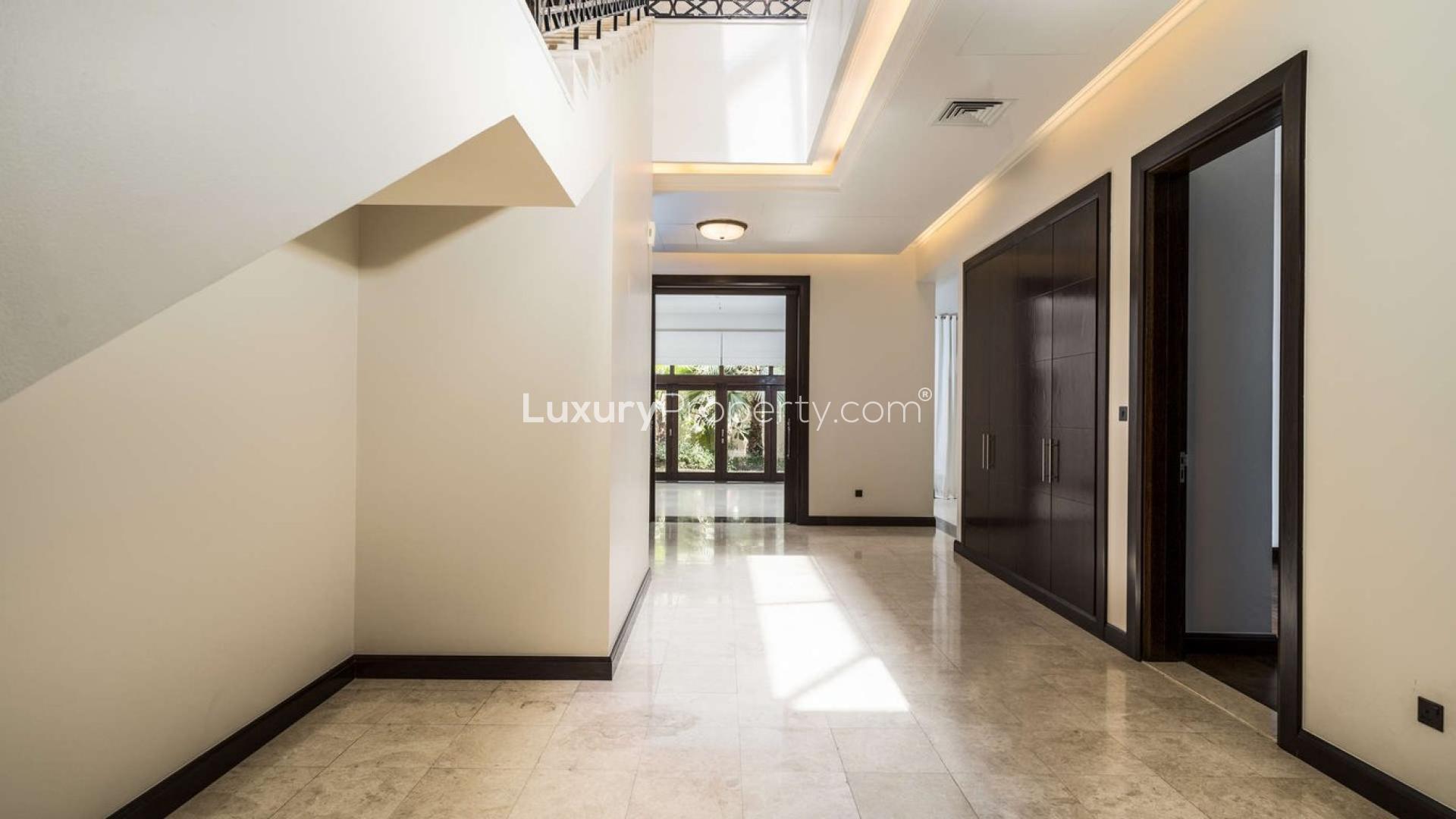 Exquisite Dahlia Villa exterior view in Al Barari, Dubai with lush greenery