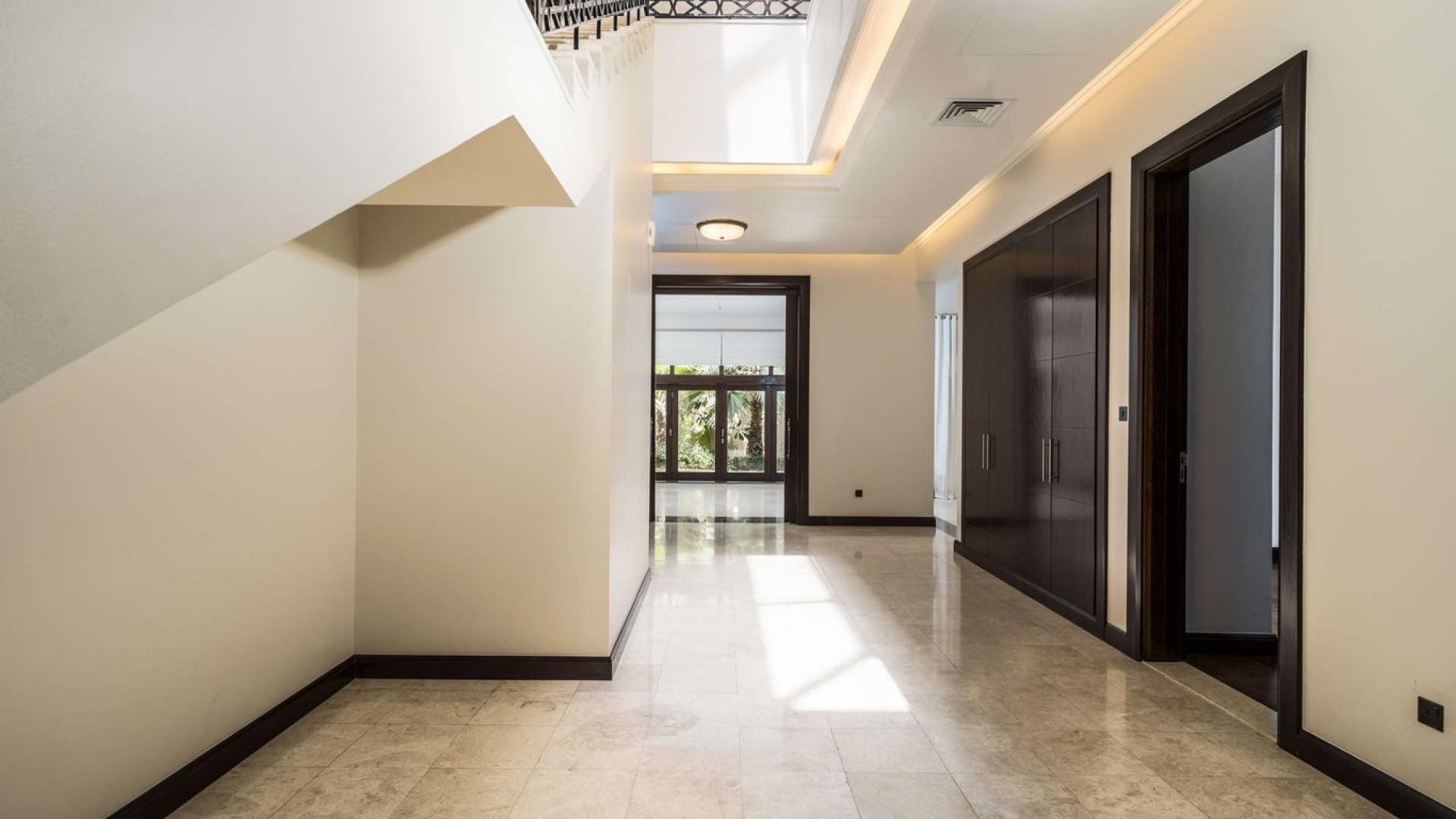 Exquisite Dahlia Villa exterior view in Al Barari, Dubai with lush greenery