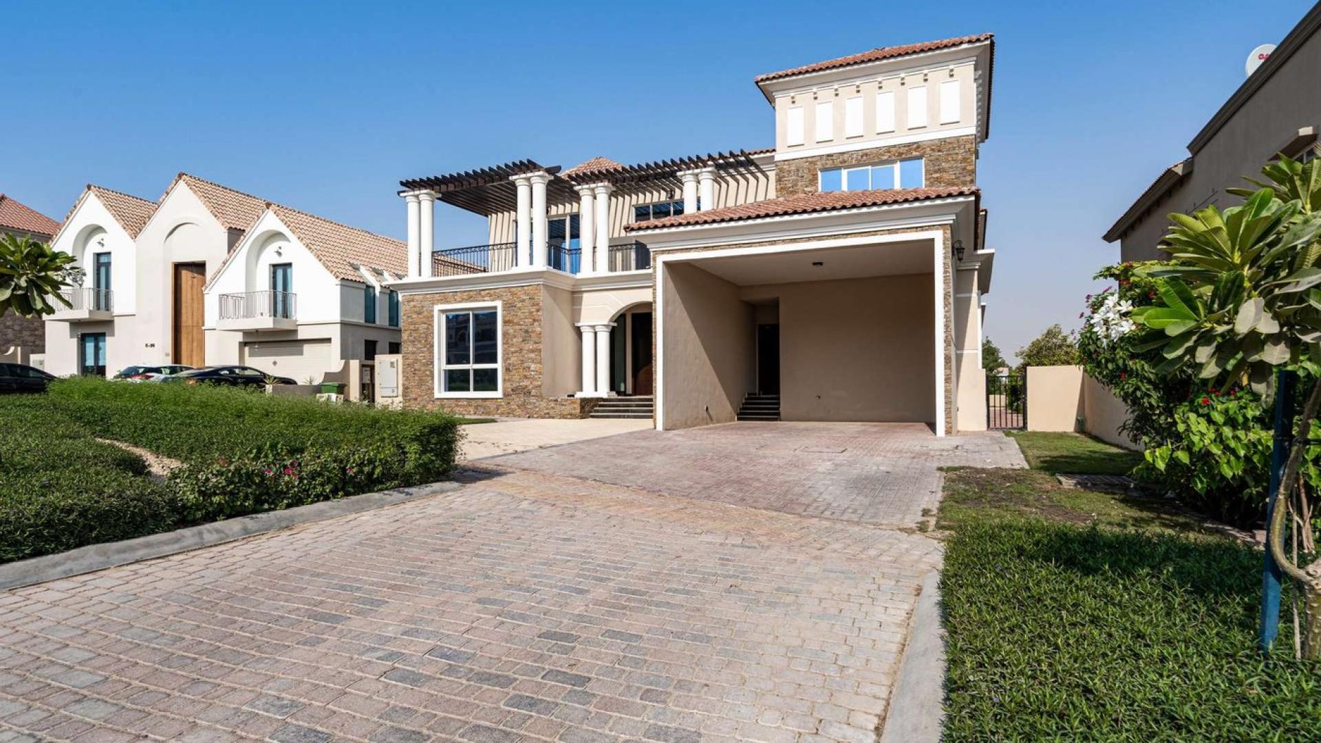 Exceptional six-bedroom villa exterior with driveway in Jumeirah Golf Estates, Earth Course