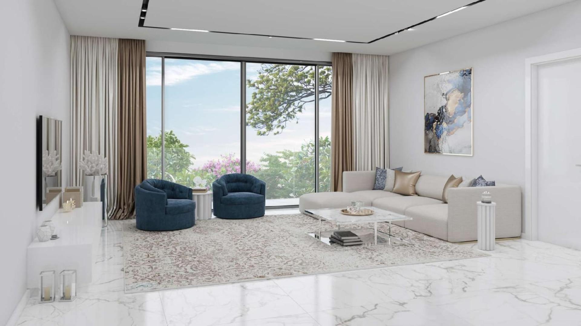 Luxurious living room in The Nest Villas, Al Barari with modern decor and garden view