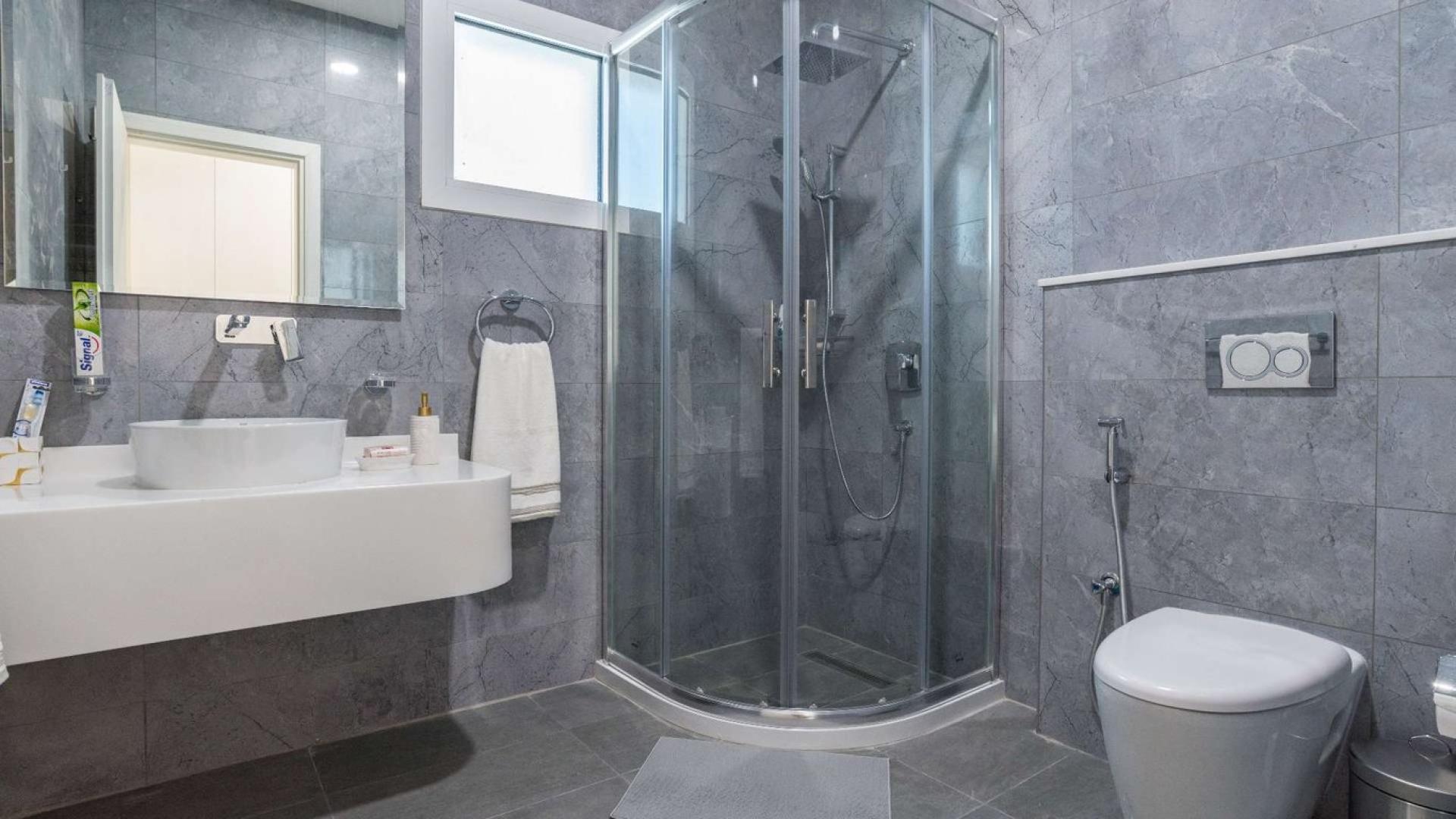 Contemporary villa interior in Pearl Jumeirah, featuring elegant dining and living areas