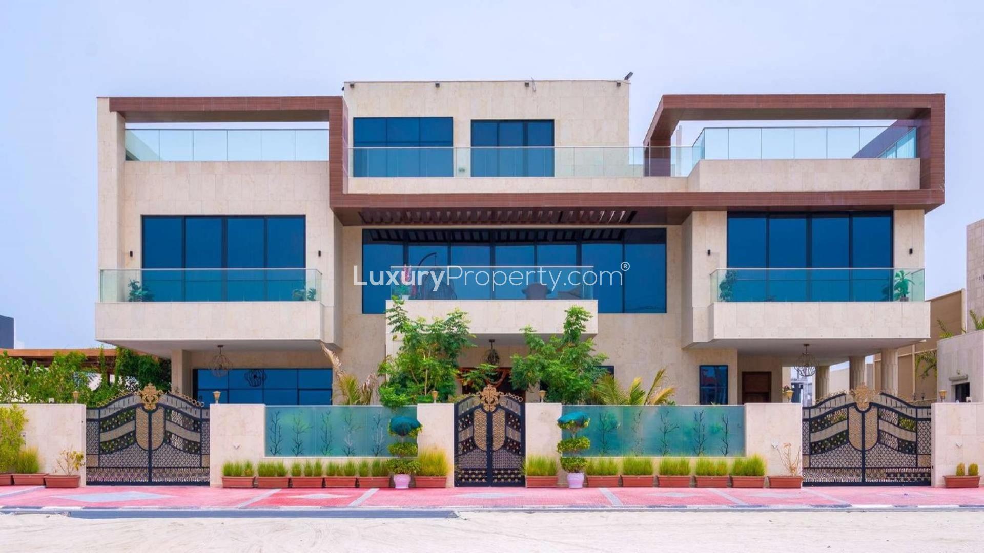 Luxurious living room in custom-built Pearl Jumeirah villa with elegant decor and pool view