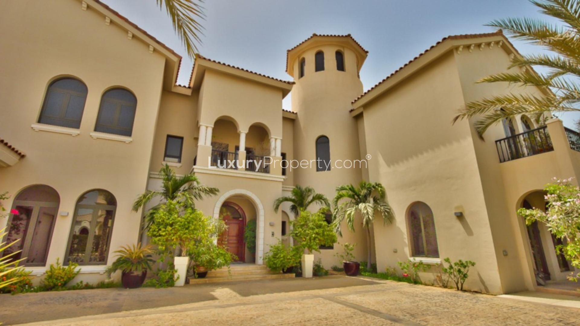 Modern kitchen in upgraded Signature Villa, Palm Jumeirah, with sleek appliances and wooden island