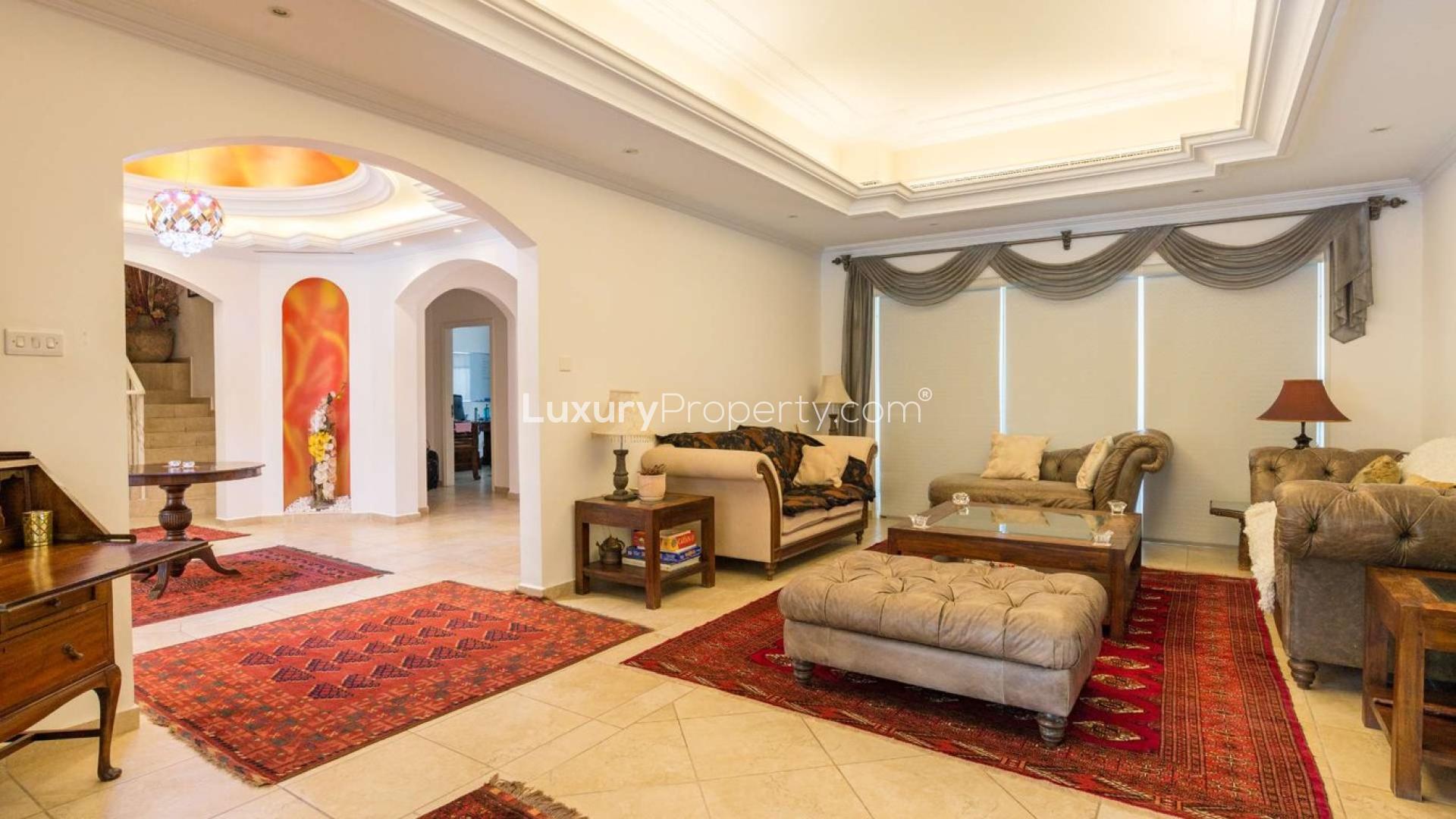 Luxury villa exterior with landscaped garden in Green Community West, six bedrooms for sale