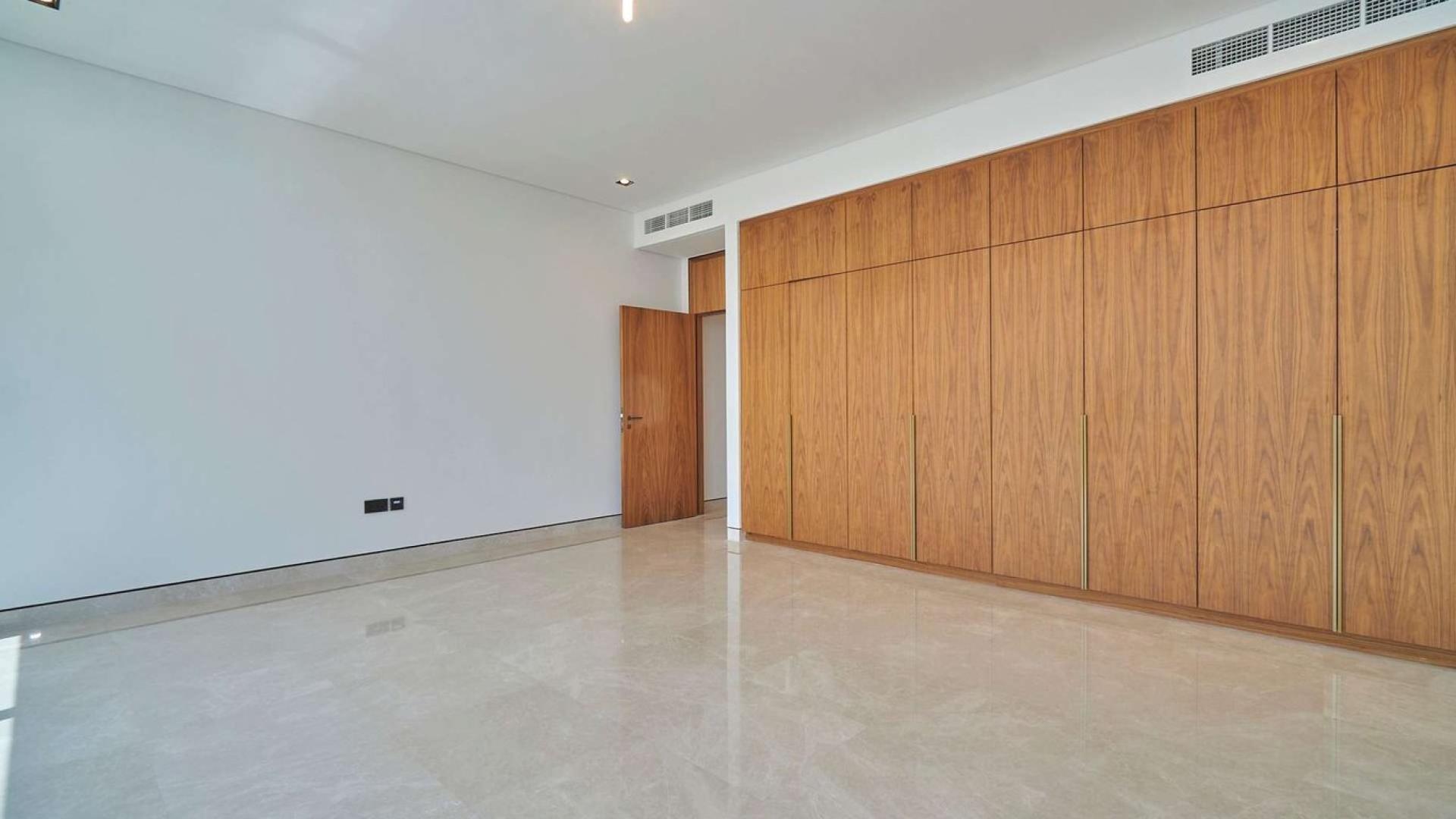 Elegant villa exterior with modern architecture, spacious lawn in Golf Place, Dubai Hills Estate