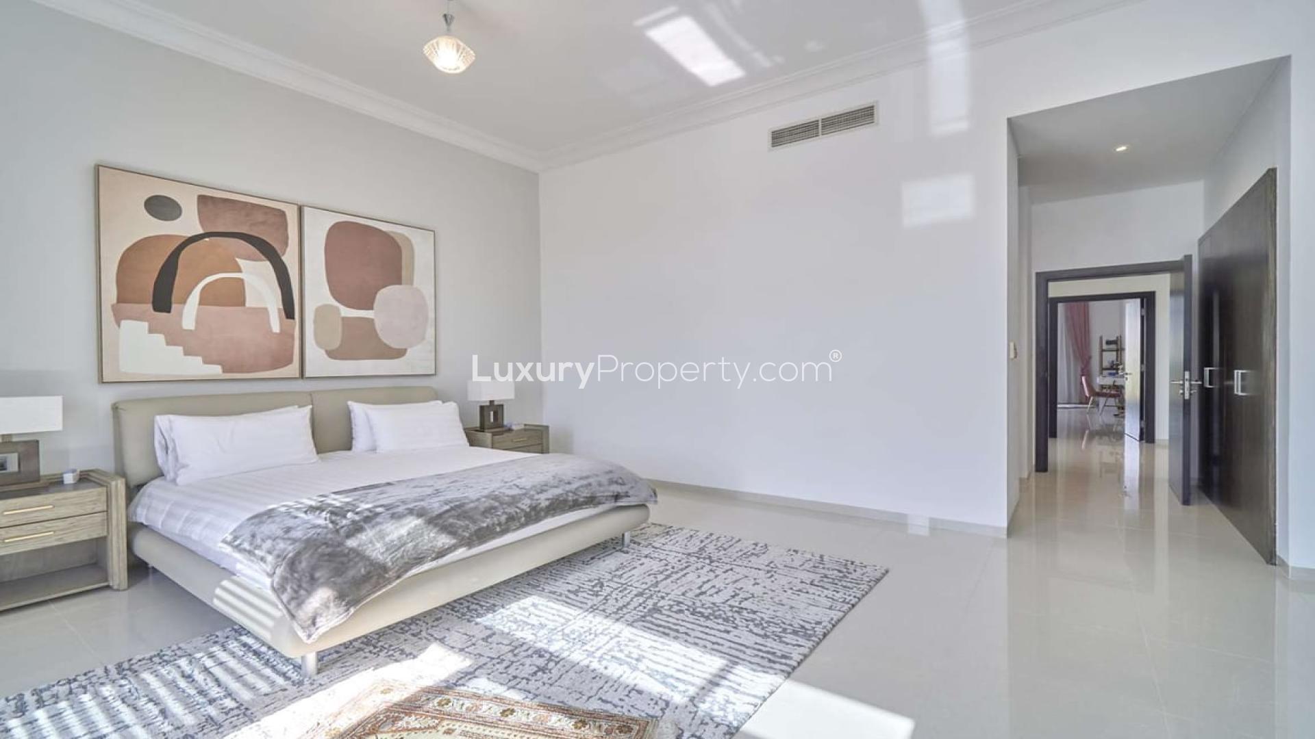 Luxurious living room in exclusive 6-bedroom villa, Damac Hills, The Field, with pool view