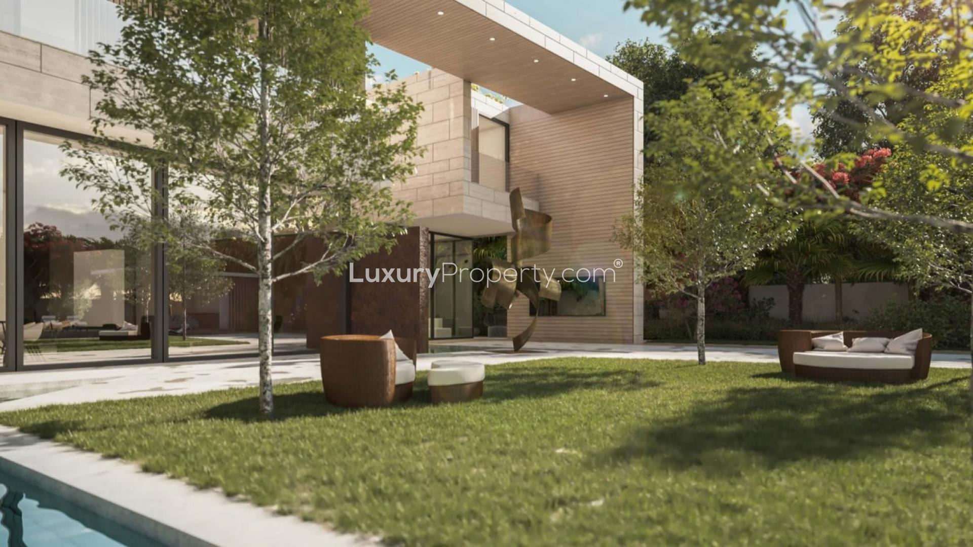 Modern luxury villa exterior with lush garden in Al Barari, Lunaria