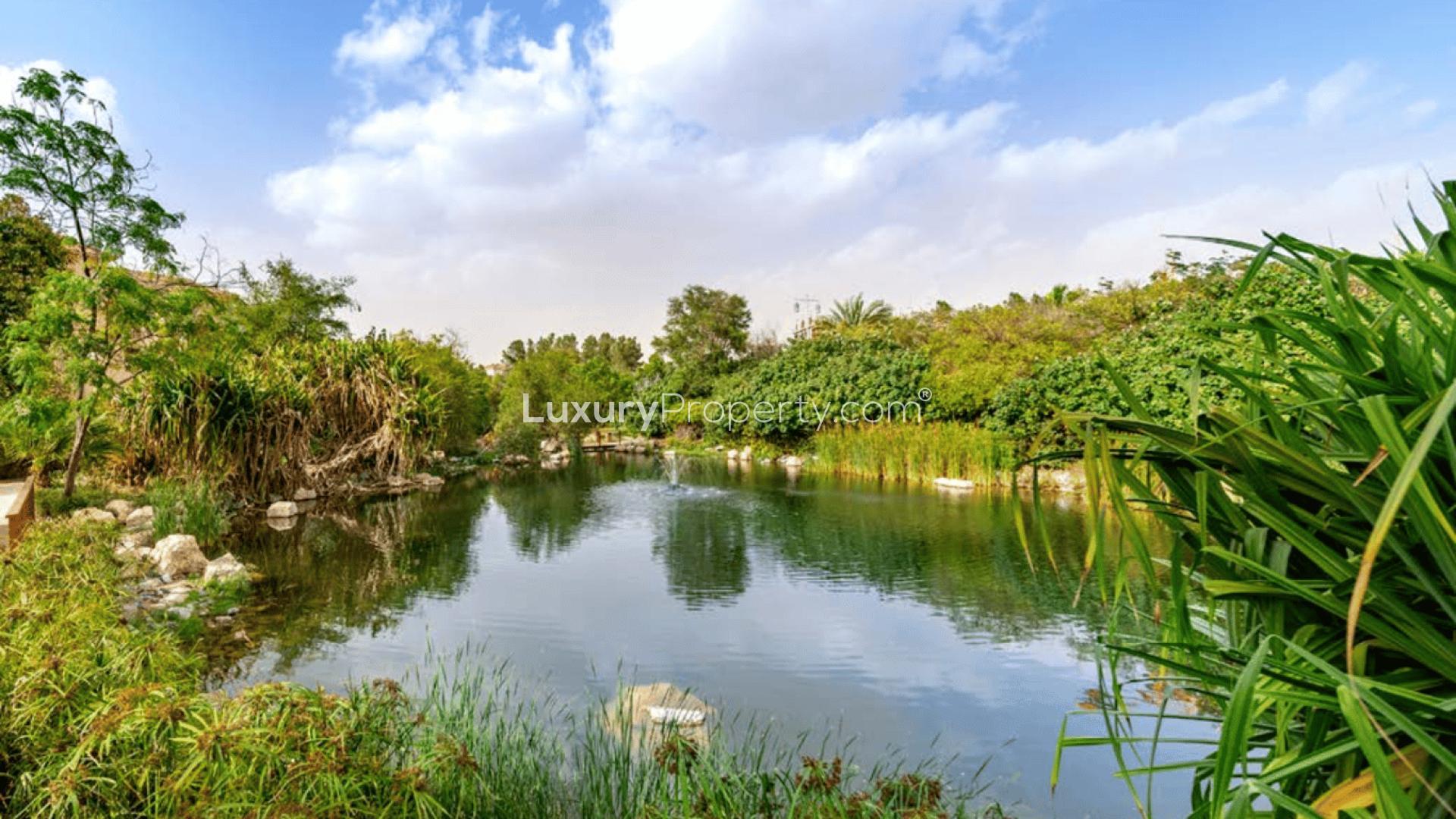 Modern Lunaria Villa exterior with lush garden in Al Barari, for sale