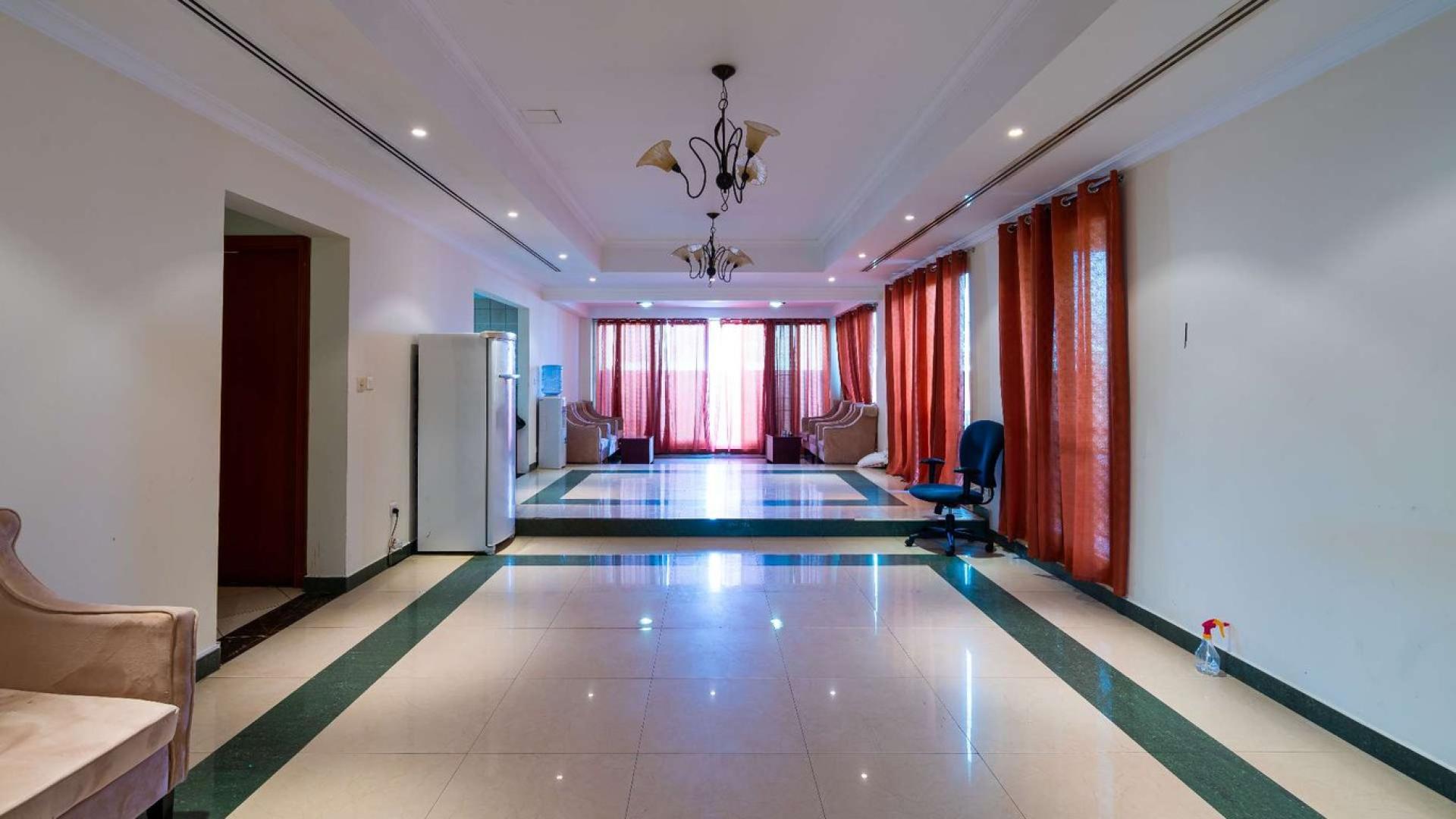 Luxurious 6-bedroom villa exterior in Al Wasl, Jumeirah District, with landscaped garden