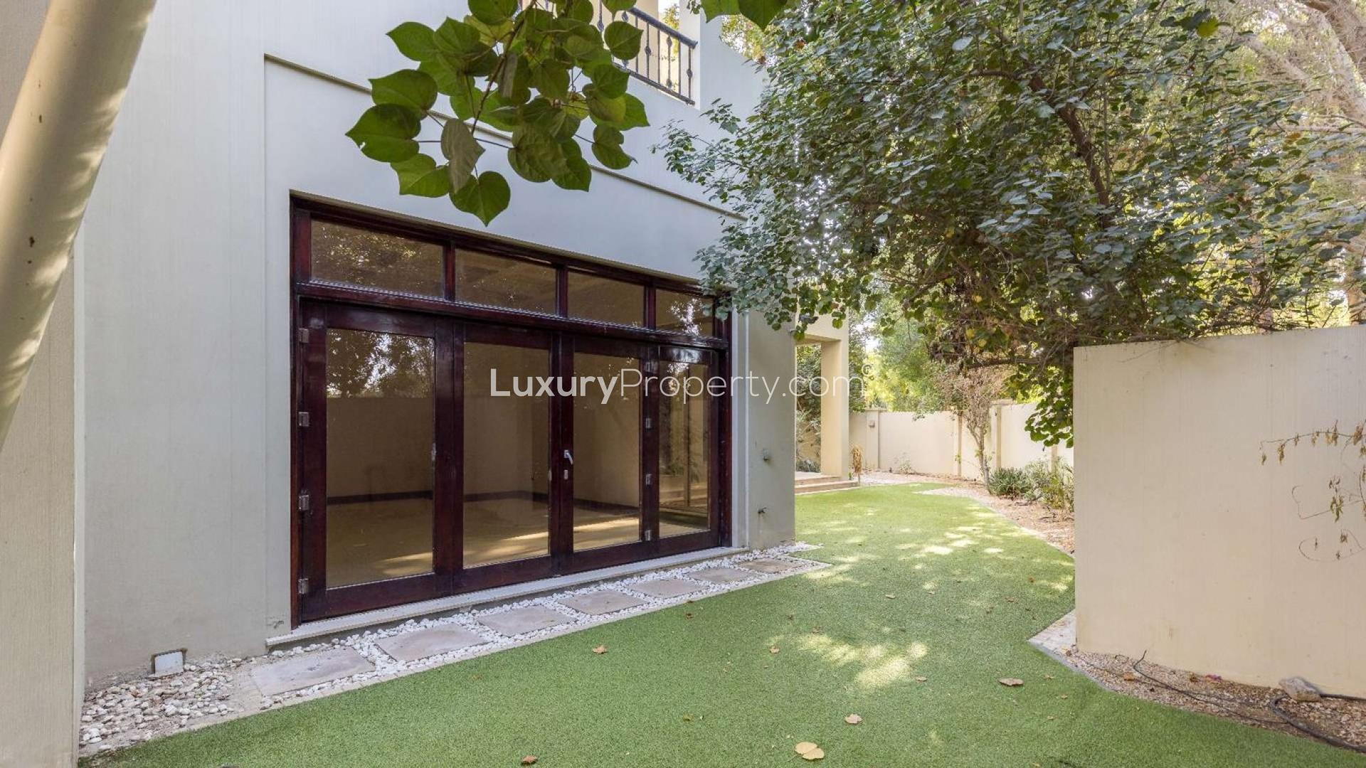 Exterior view of 6-bedroom B-Type villa in Al Barari Villas, lush greenery surrounding